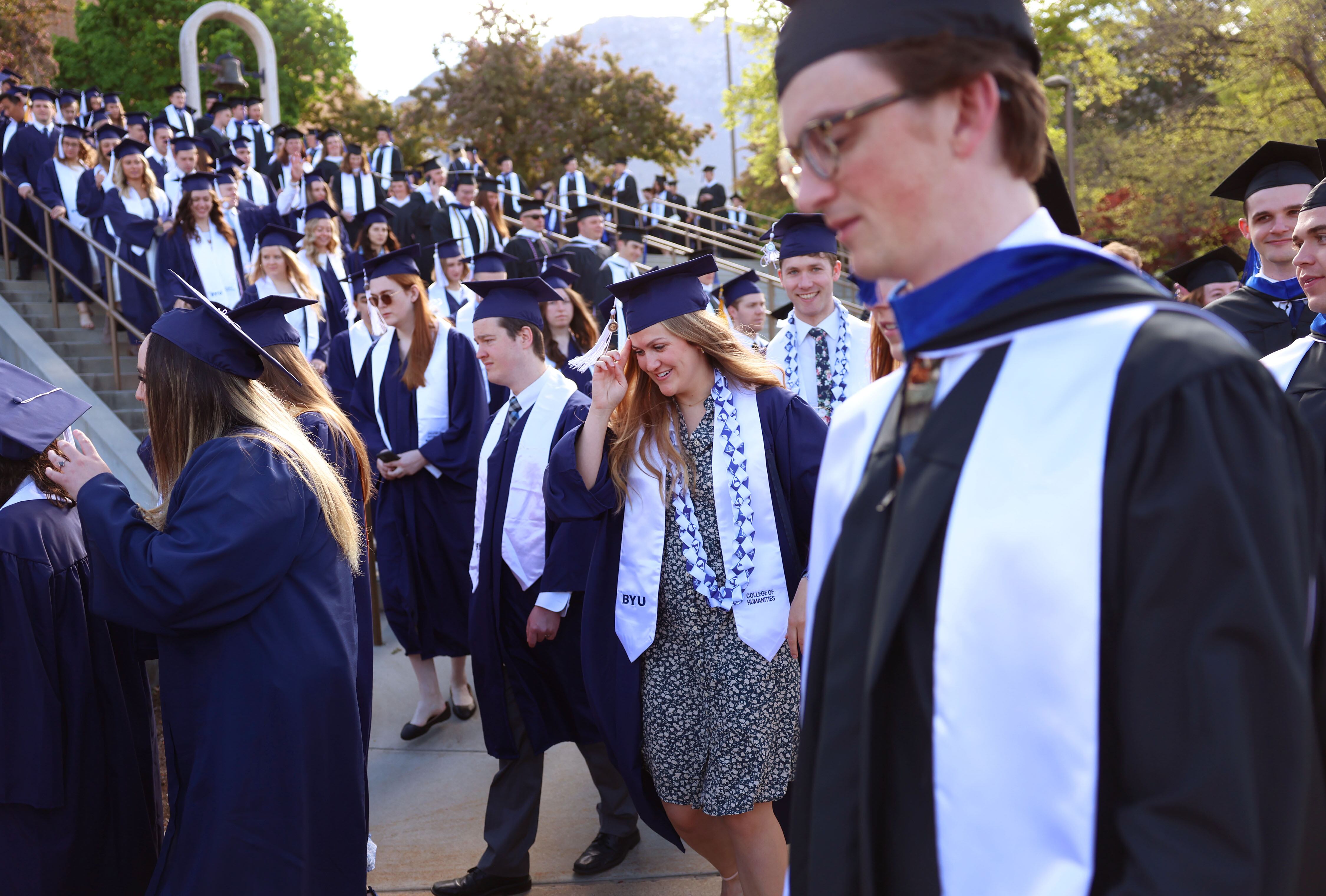 BYU students enter the Marriott Center in Provo for their commencement ceremony on April 25. A new survey shows 1 in 4 American adults say it's extremely or very important to have a four-year college degree.