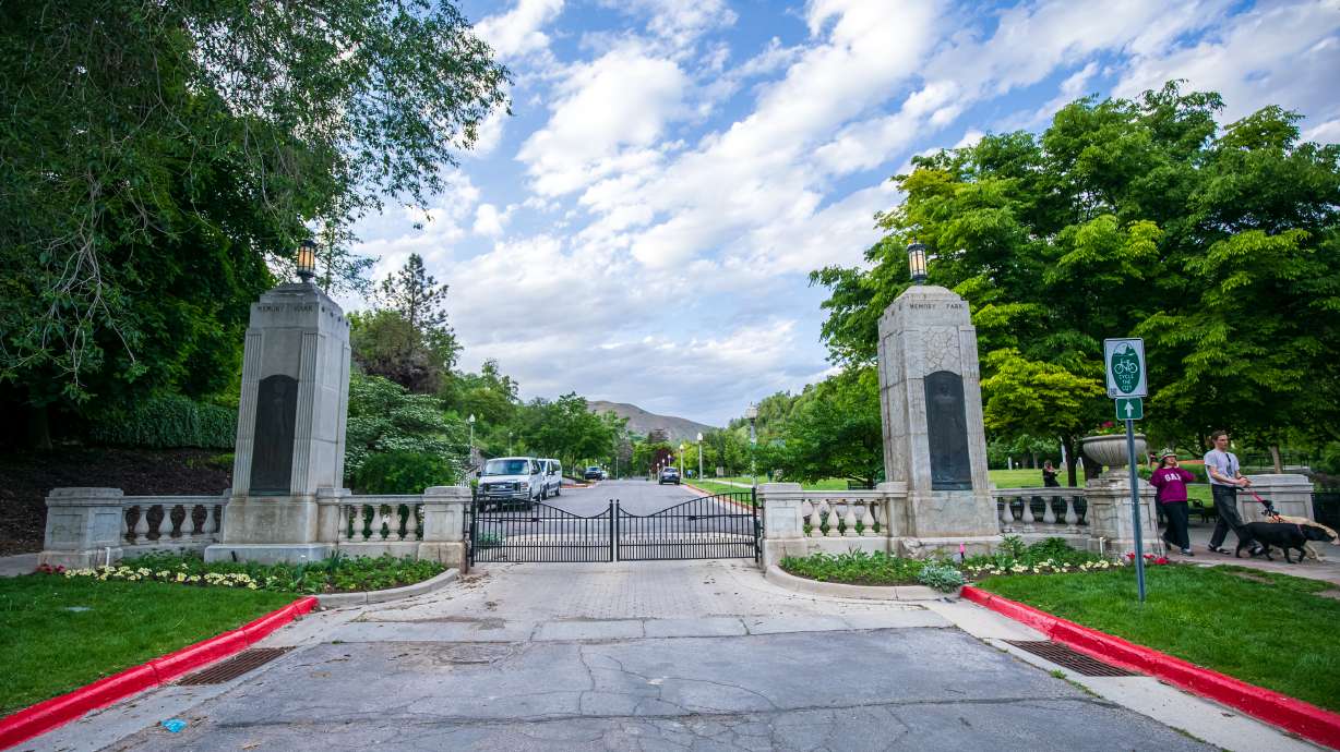 People walk past the gates at Memory Grove Park in Salt Lake City on Wednesday. The park became a place to remember fallen Utah soldiers in 1924.