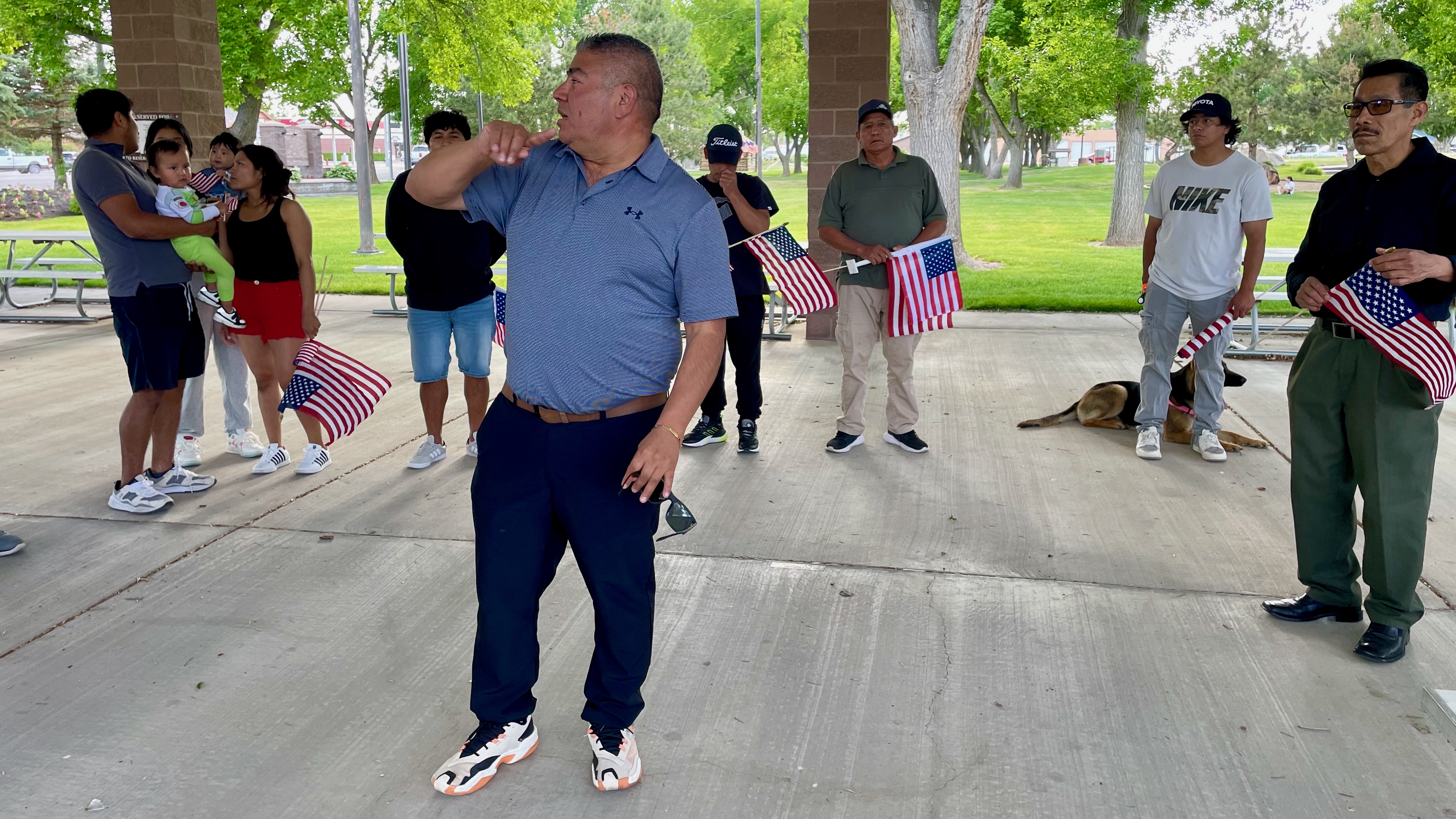Carlos Lazaro addresses a gathering of former Delta Egg Farm workers before a protest march on Main Street in Delta on Wednesday. He runs the firm that hired much of the contract labor for the egg farm.