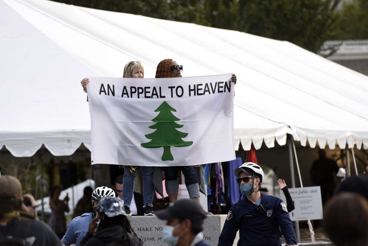 People carry an "Appeal To Heaven" flag as they gather at Independence Mall to support President Donald Trump during a visit to the National Constitution Center to participate in the ABC News town hall, Sept. 15, 2020, in Philadelphia. Supreme Court Justice Samuel Alito is embroiled in a second flag controversy, this time over the “Appeal to Heaven” flag.