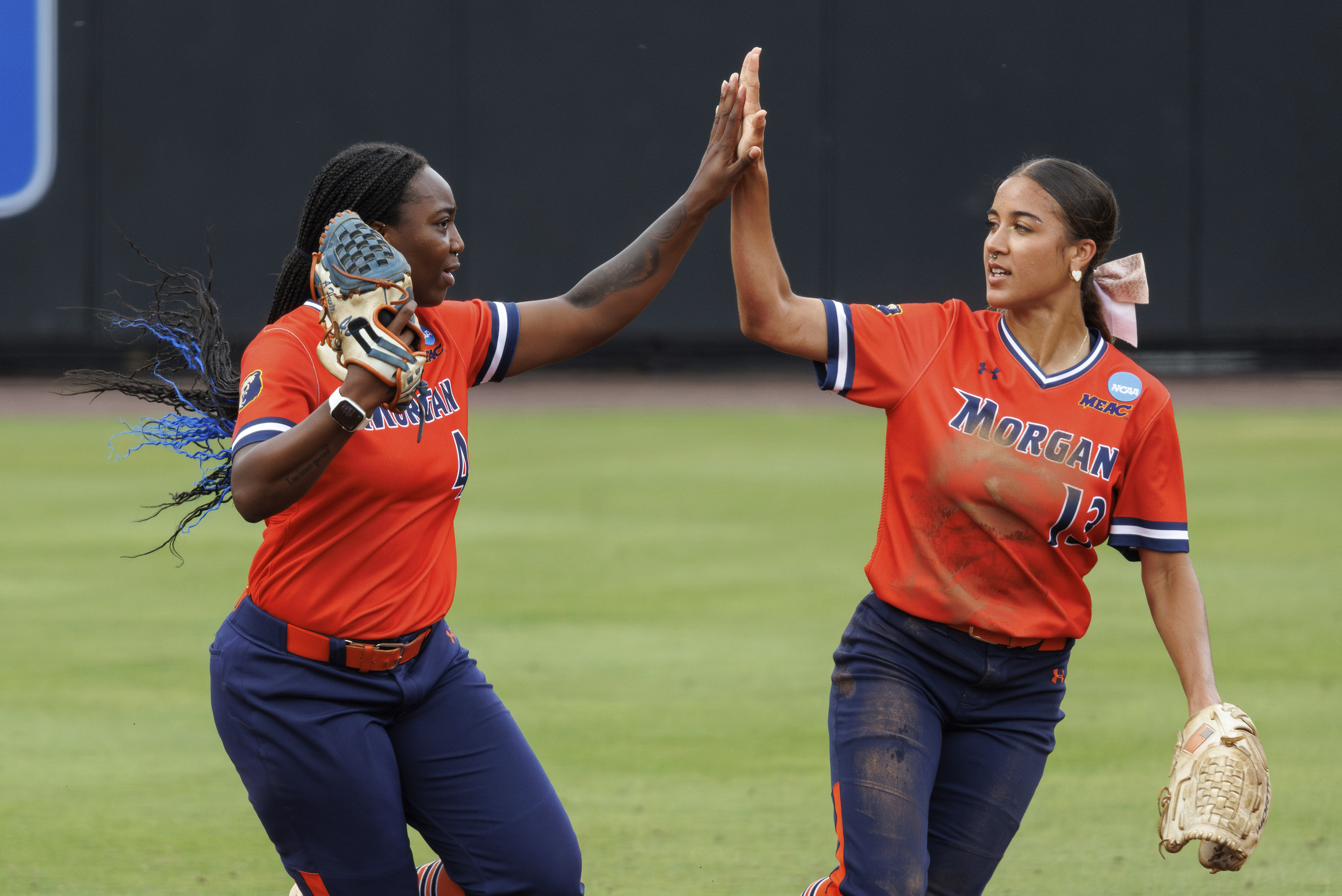 Morgan State's Anaya Hunte, left, celebrates with Mia Ewell (13) after making a catch during an NCAA college softball game against Duke, Friday, May 17, 2024, in Durham, N.C. 