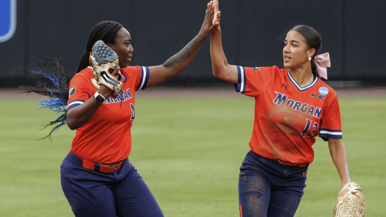 Morgan State's Anaya Hunte, left, celebrates with Mia Ewell (13) after making a catch during an NCAA college softball game against Duke, Friday, May 17, 2024, in Durham, N.C.