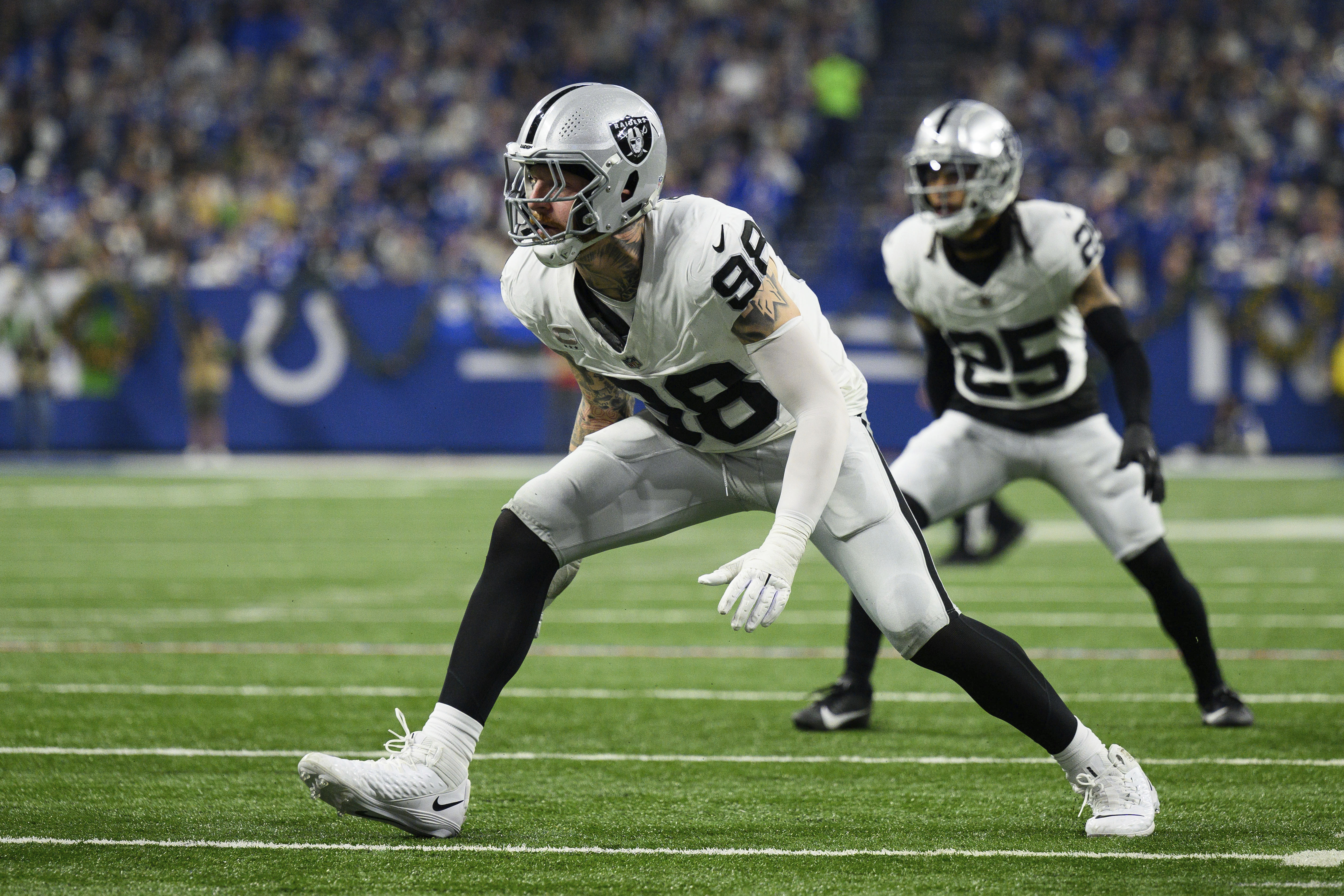 FILE - Las Vegas Raiders defensive end Maxx Crosby (98) lines up for a play during the team's NFL football game against the Indianapolis Colts, Dec. 31, 2023, in Indianapolis. Crosby is getting a $6 million raise this season and an additional $1.2 million next year, according to someone with knowledge of the deal.