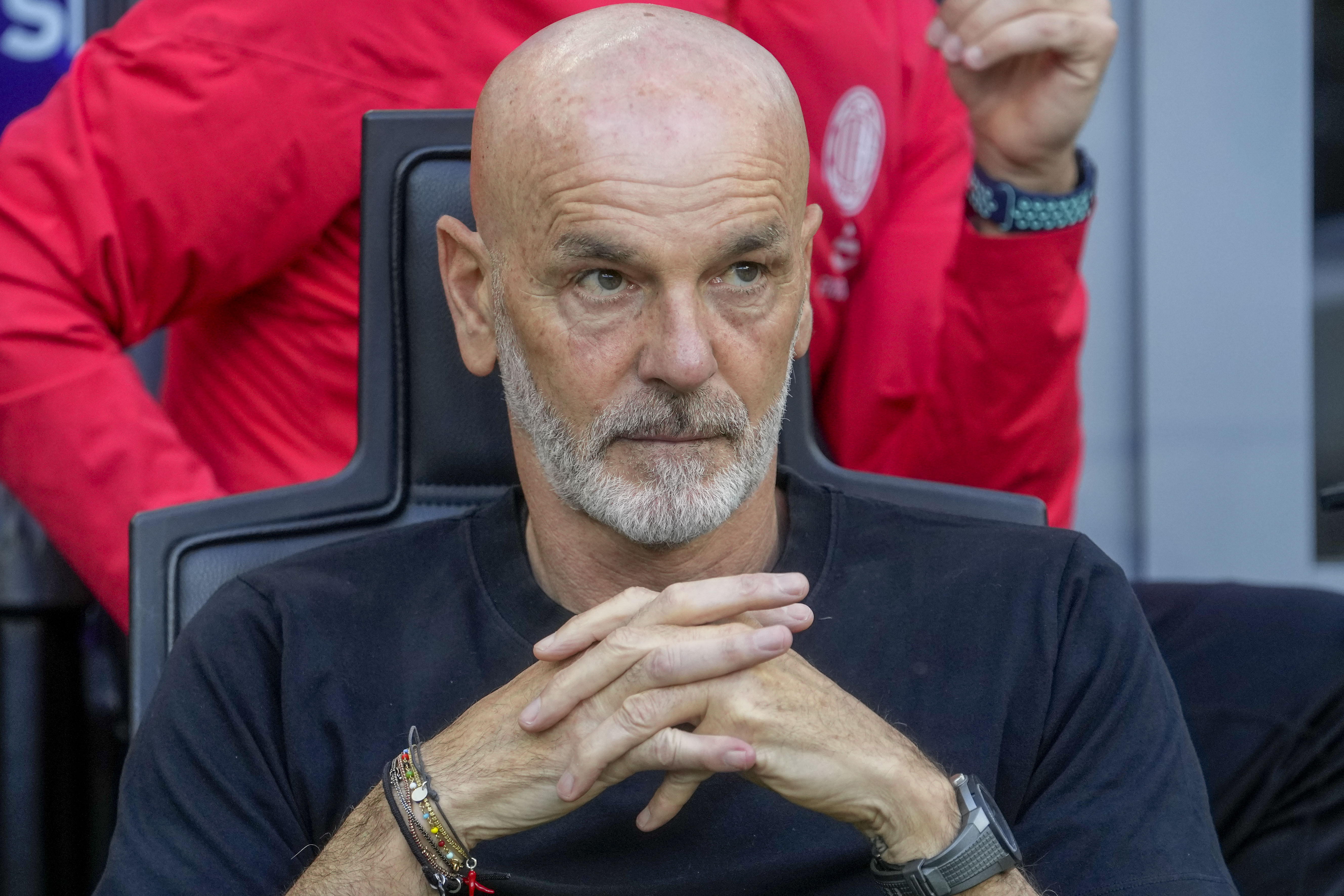AC Milan's manager Stefano Pioli looks out from the bench prior a Serie A soccer match between AC Milan and Genoa, at the San Siro stadium in Milan, Italy, Sunday, May 5, 2024. 