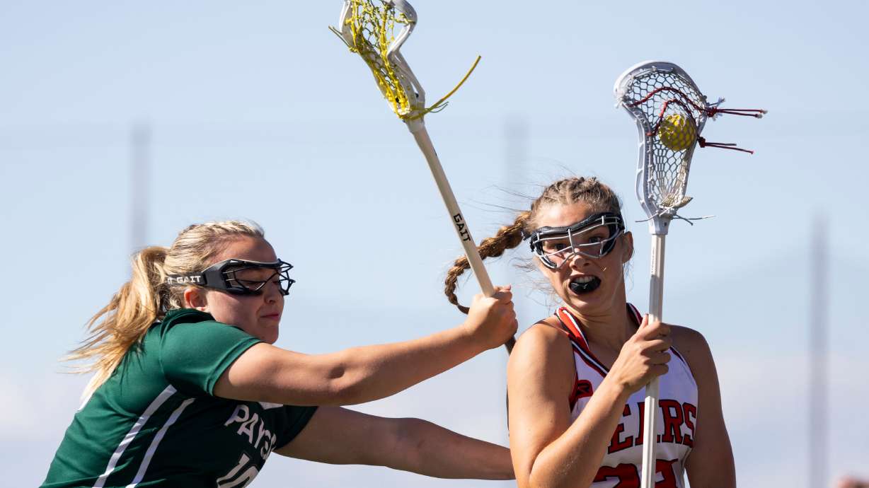 Bear River Bears' Mackenzie Mickelsen (28) cradles the ball during the 4A lacrosse state championship against the Payson Lions at the Zions Bank Stadium in Herriman on Thursday, May 23, 2024.