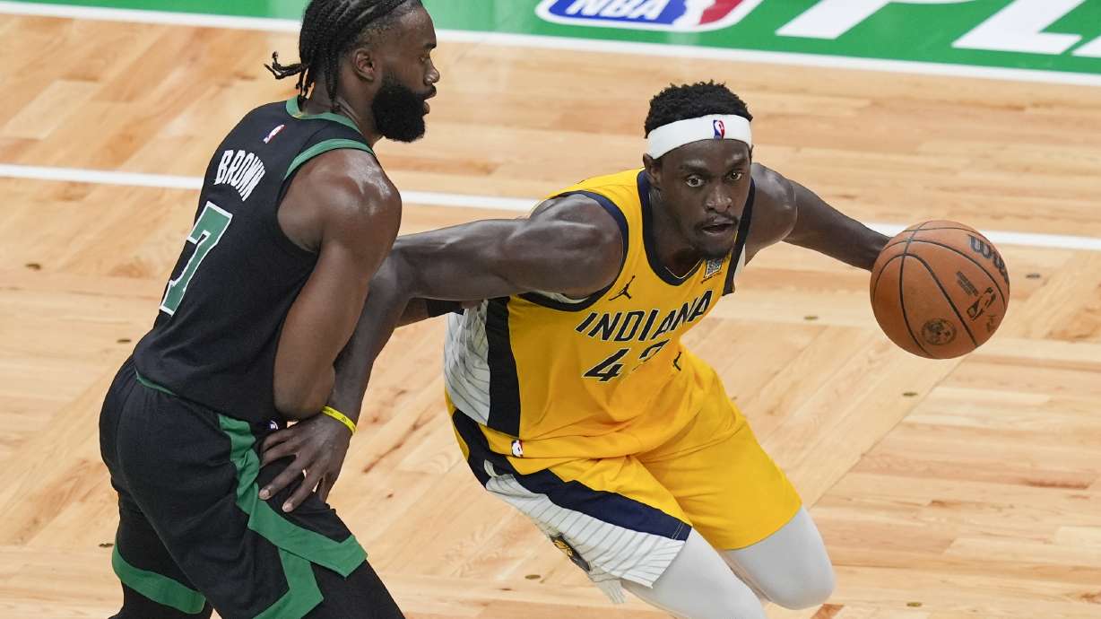 Indiana Pacers forward Pascal Siakam, right, is defended by Boston Celtics guard Jaylen Brown (7) during the second half of Game 2 of the NBA Eastern Conference basketball finals Thursday, May 23, 2024, in Boston.