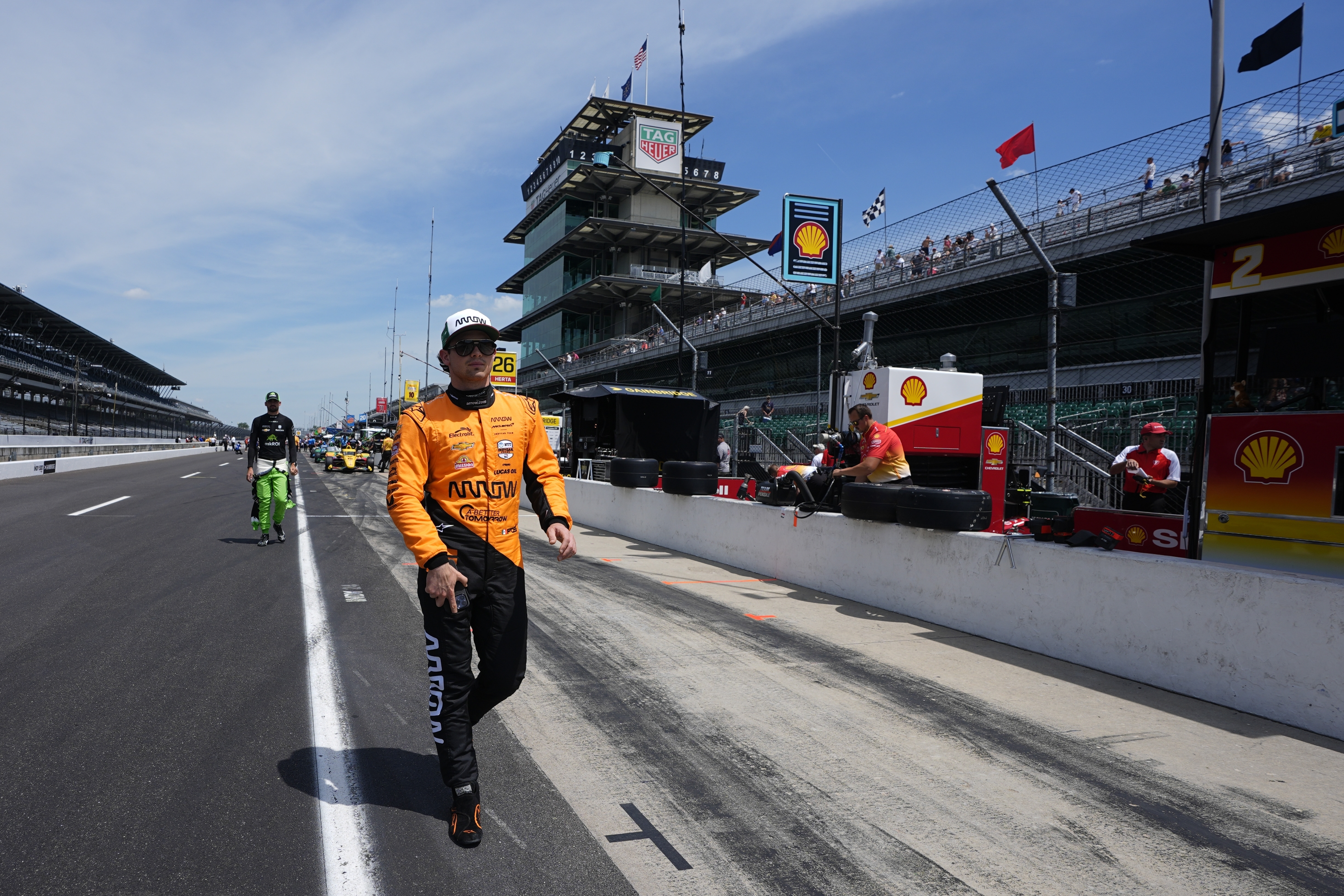 Pato O'Ward, of Mexico, walk down pit lane during a practice session for the Indianapolis 500 auto race at Indianapolis Motor Speedway, Monday, May 20, 2024, in Indianapolis. 