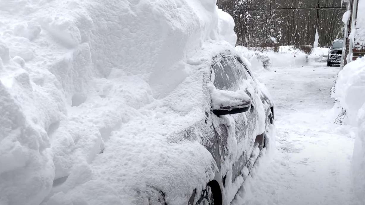 A car is covered with snow in Orchard Park, New York, in this Nov. 19, 2022, video.