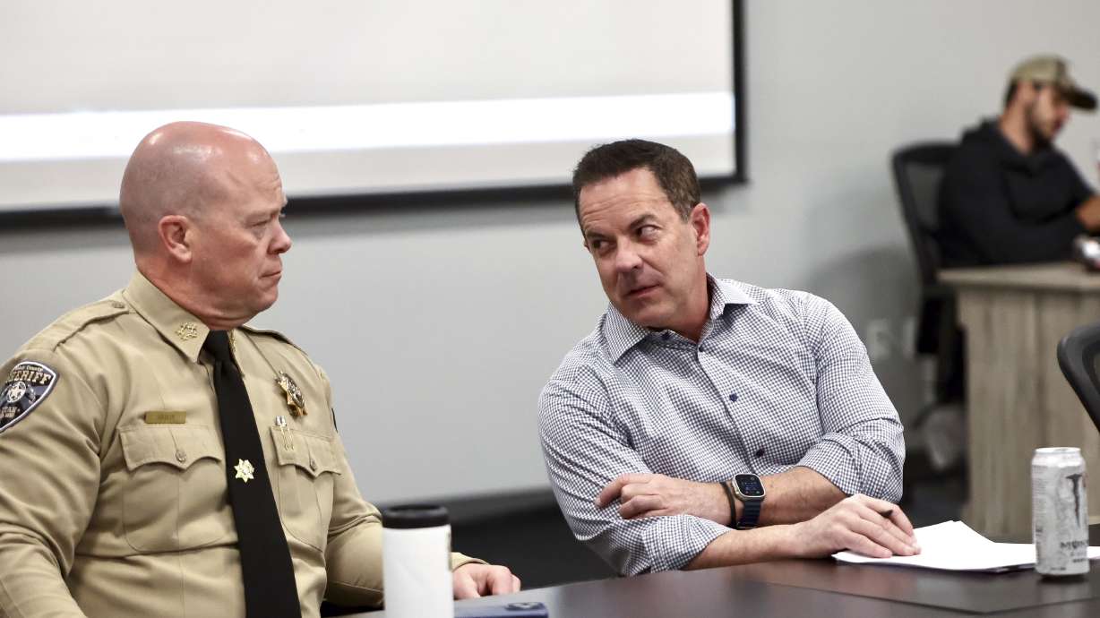 U.S. Senate candidate Brad Wilson and Weber County Sheriff Ryan Arbon talk during a press conference with local officials on immigration at the Weber County Sheriff’s Office in Ogden on Friday.