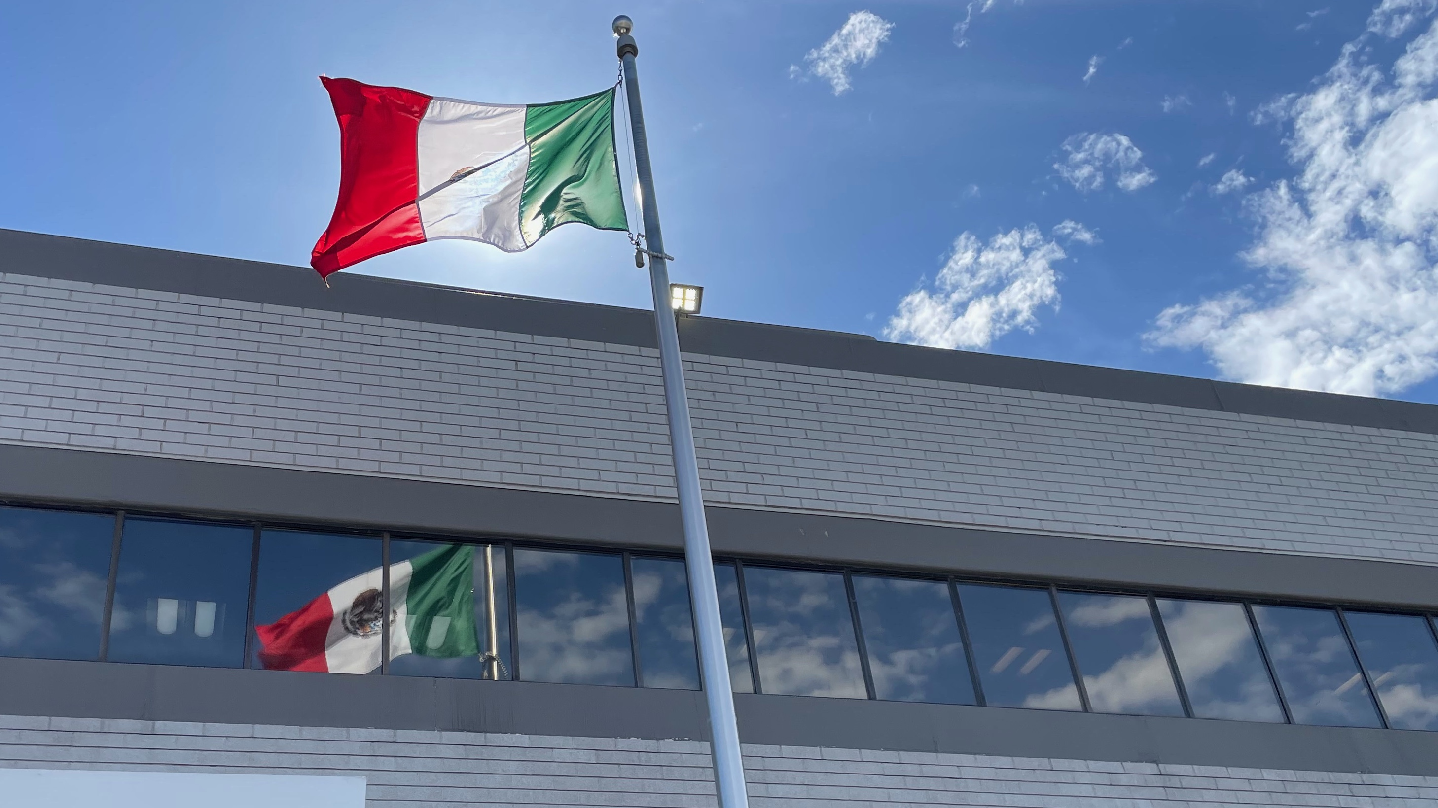 The photo shows the Mexican flag flying outside the Mexican Consulate in Salt Lake City on Friday.