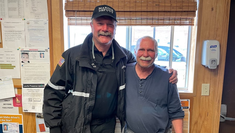 Custer County Sheriff’s Marine Deputy John Haugh, left, stands with Thomas Gray, who survived five days in the wilderness, in this undated photo.