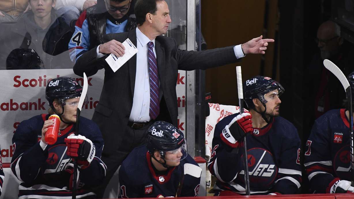 FILE - Winnipeg Jets associate coach Scott Arniel gestures to players during the third period of the team's NHL hockey game against the St. Louis Blues on Oct. 24. 2023, in Winnipeg, Manitoba. The Jets promoted Arniel to head coach Friday, May 24, replacing the retired Rick Bowness The move comes almost three weeks after Bowness retired. A former Jets left wing, Arniel joined Bowness' staff in 2022.