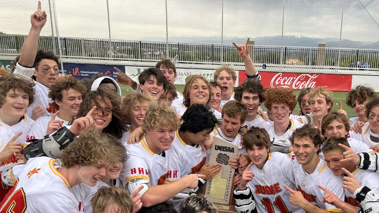 Judge Memorial boys lacrosse celebrates its first state championship.