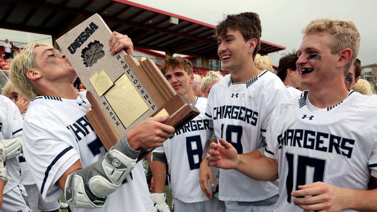 Corner Canyon celebrates winning the 6A boys lacrosse state championship game against Davis at Zions Bank Stadium in Herriman on Friday, May 24, 2024. Corner Canyon won in double overtime 12-11.