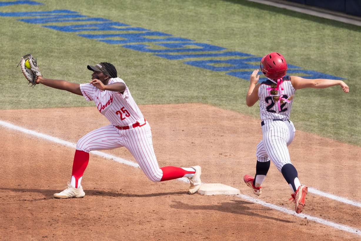 Spanish Fork first baseman Alyce Archuleta (25) catches the ball taking out Springville's Allie Fowler (22) during the 5A softball state championship at the Miller Park Complex in Provo, on Friday, May 24, 2024.