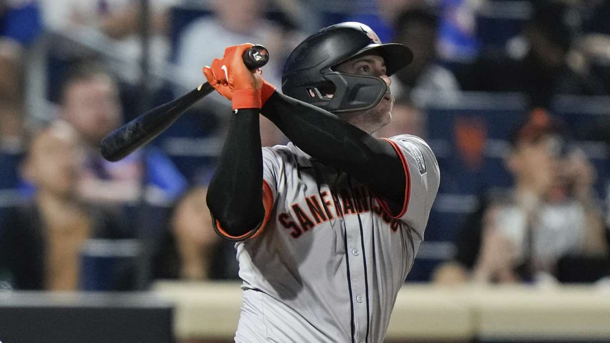 San Francisco Giants' Patrick Bailey watches his grand slam against the New York Mets during the eighth inning of a baseball game Friday, May 24, 2024, in New York.