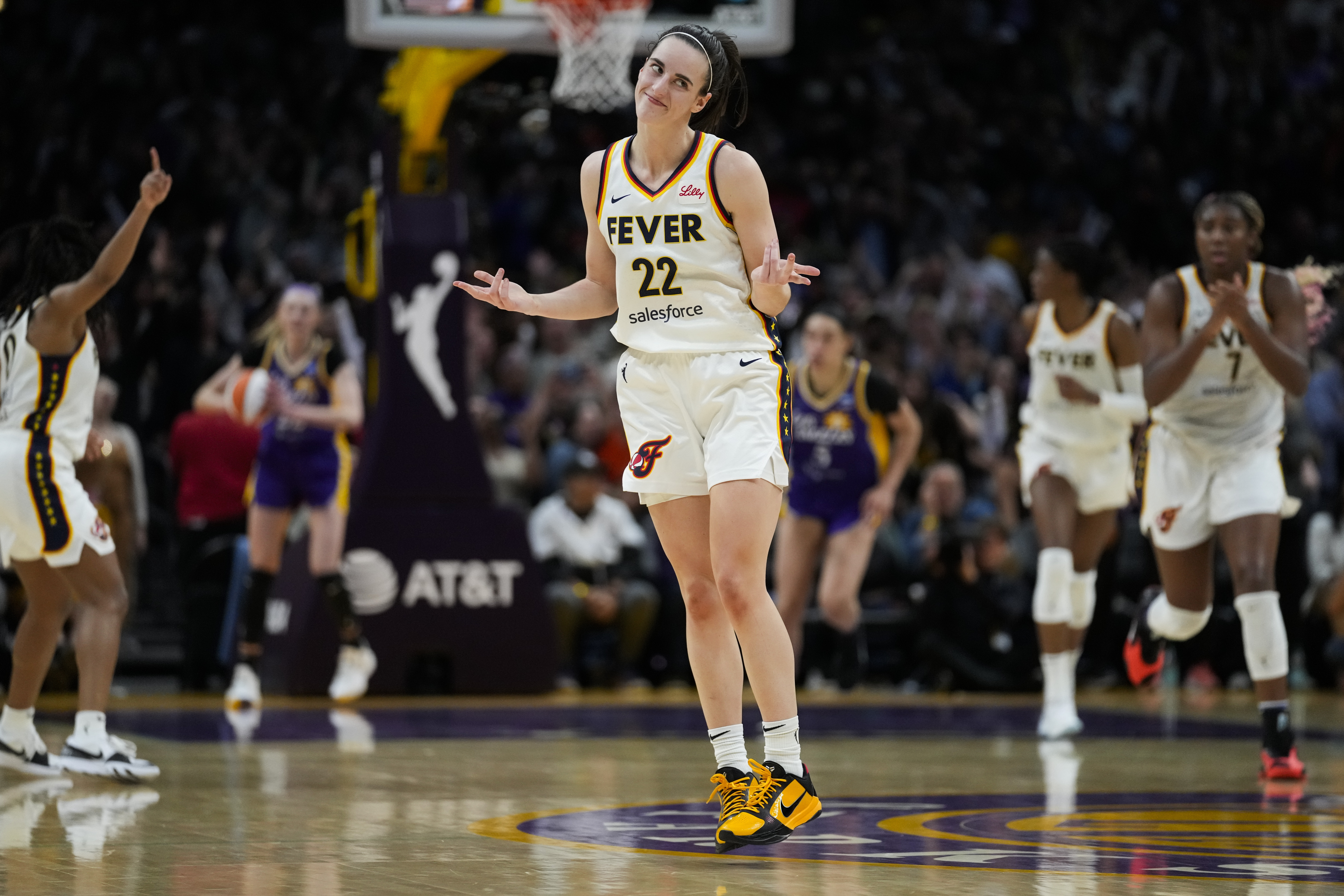 Indiana Fever guard Caitlin Clark (22) celebrates after making a 3-pointer during the second half of a WNBA basketball game against the Los Angeles Sparks in Los Angeles, Friday, May 24, 2024. 