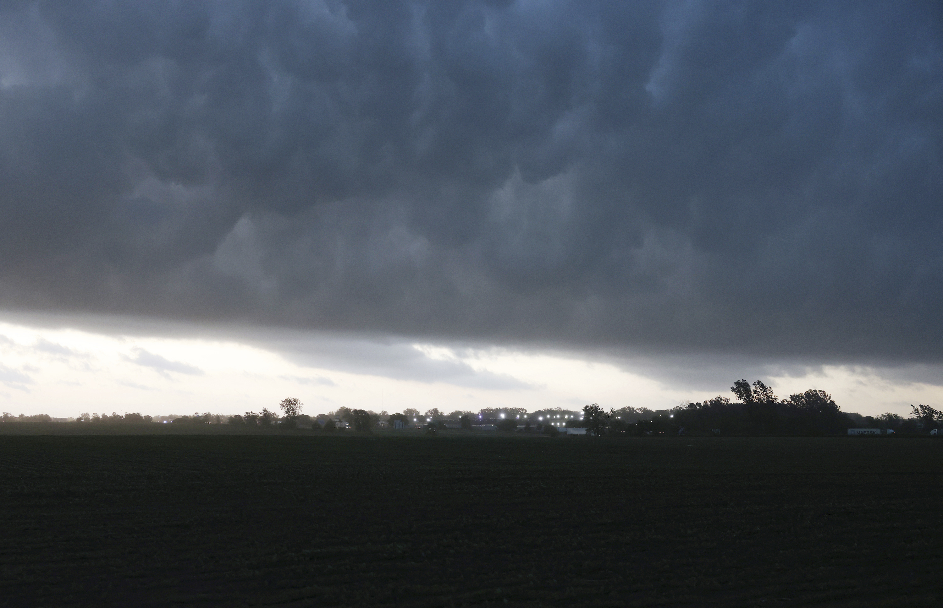 Severe storm clouds move along Interstate 80 at the northwest edge of Davenport, Iowa on Friday. Several tornadoes were reported in Iowa and Illinois as storms downed power lines and trees on Friday, just after a deadly twister devastated one small town.