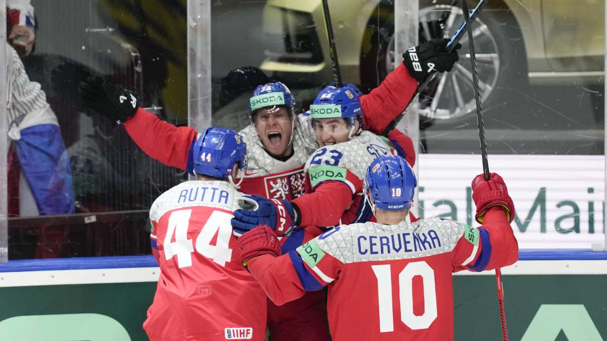 Czech Republic's Ondrej Kase celebrates with teammates after scoring his side's third goal during the semi final match between Sweden and Czech Republic at the Ice Hockey World Championships in Prague, Czech Republic, Saturday, May 25, 2024.