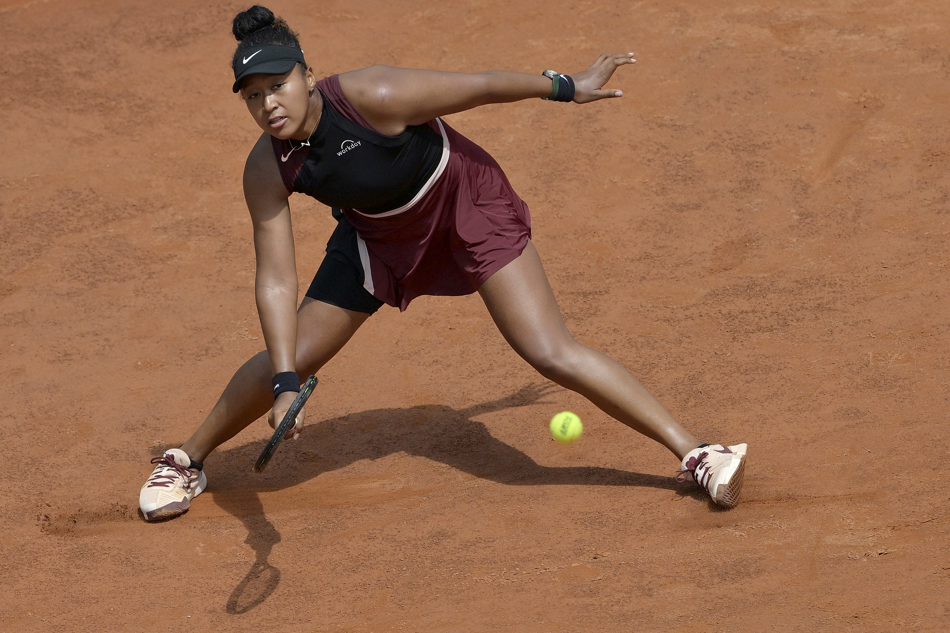 Japan's Naomi Osaka returns the ball to China's Zheng Qinwen during her match at the Italian Open tennis tournament, in Rome, Monday, May 13, 2024. Qinwen won 6-2, 6-4. 