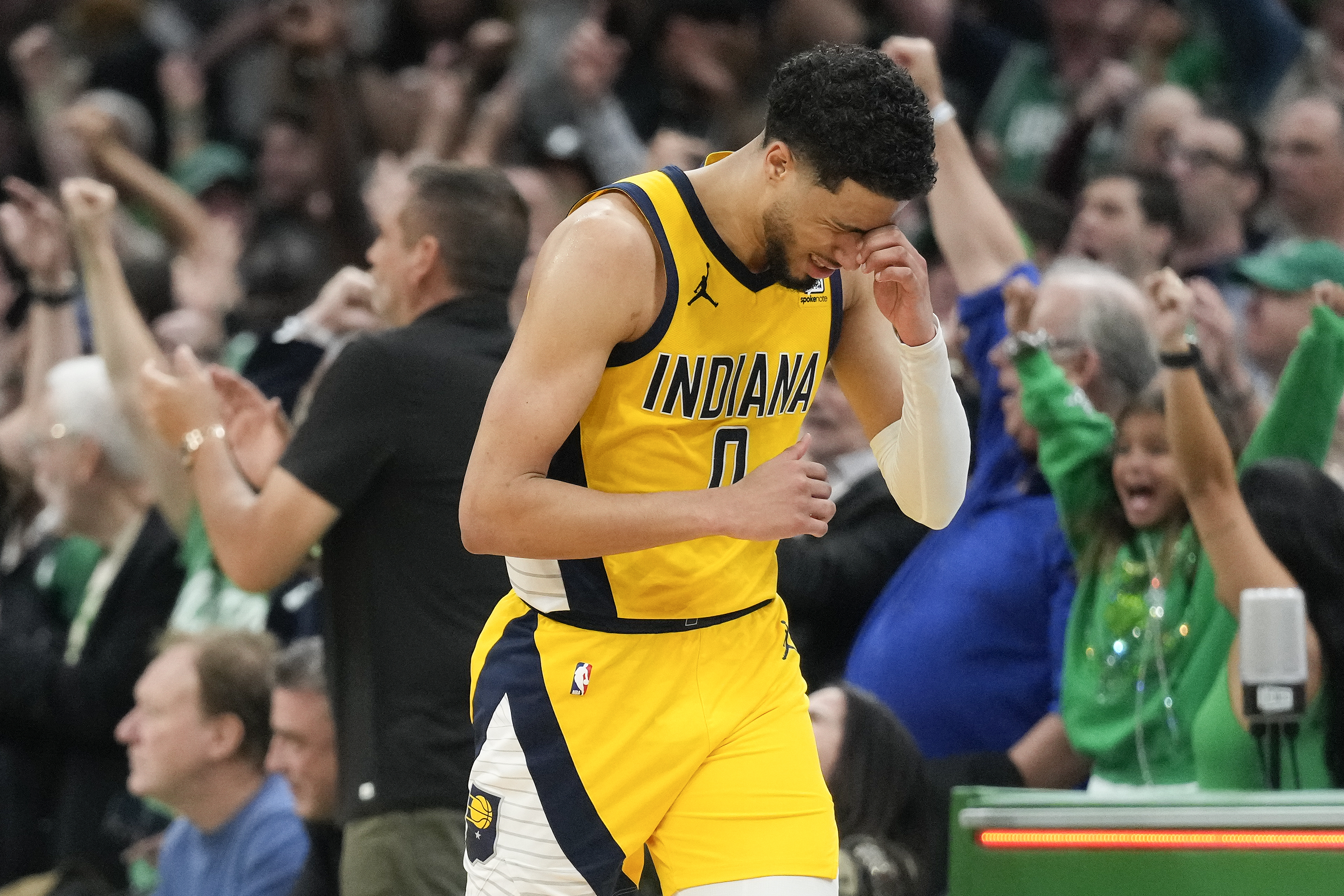 Indiana Pacers guard Tyrese Haliburton (0) reacts after missing a shot against the Boston Celtics to end regulation time in Game 1 of the NBA Eastern Conference basketball finals, Tuesday, May 21, 2024, in Boston. 