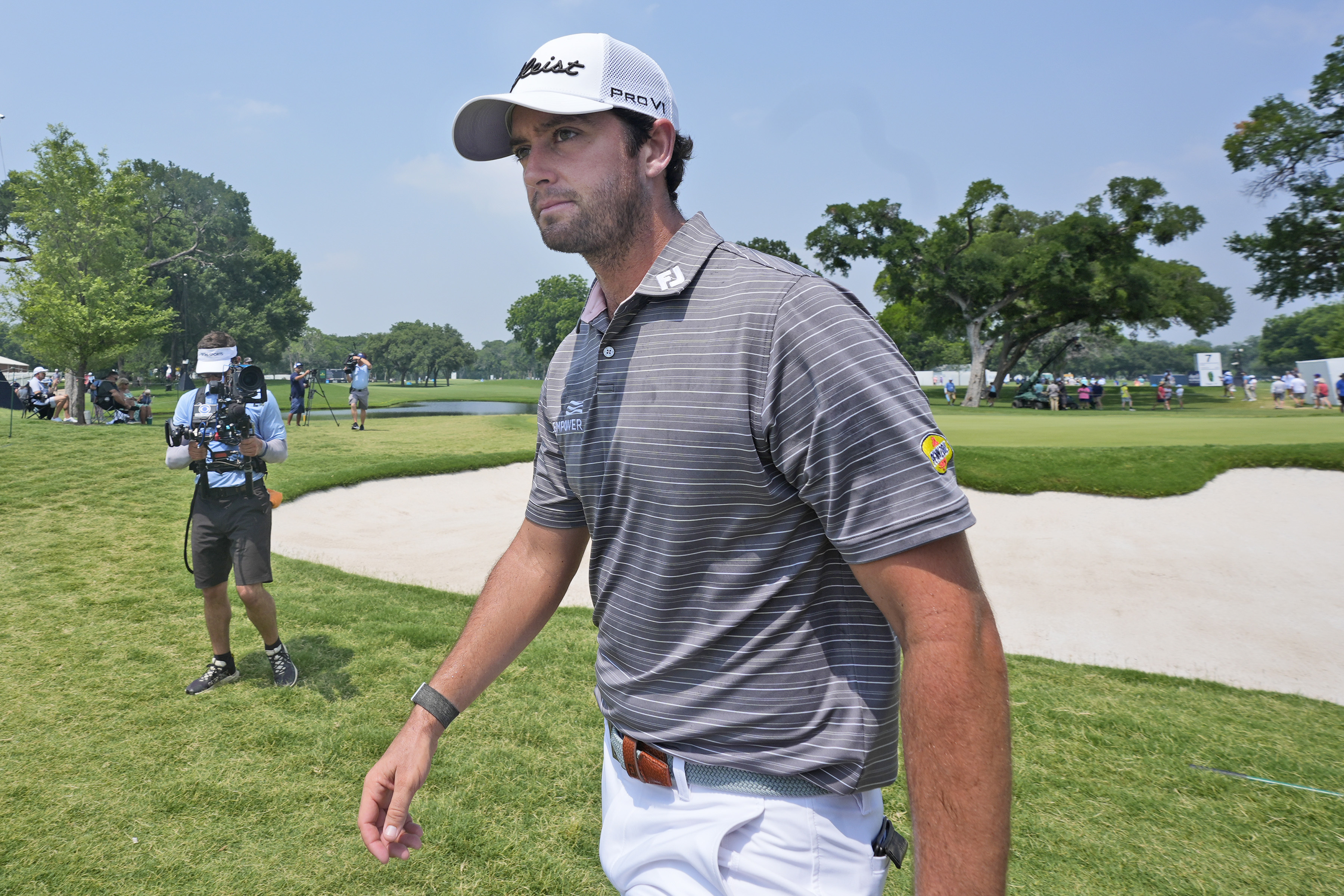 Davis Riley walks from the ninth hole during the third round of the Charles Schwab Challenge golf tournament at Colonial Country Club in Fort Worth, Texas, Saturday, May 25, 2024. 