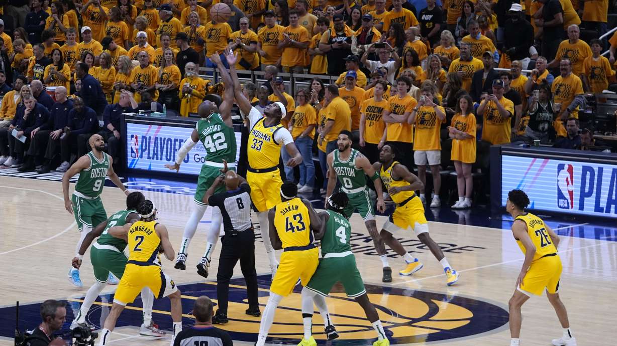 Boston Celtics center Al Horford (42) fights for the opening tip with Indiana Pacers center Myles Turner (33) during the first half of Game 3 of the NBA Eastern Conference basketball finals, Saturday, May 25, 2024, in Indianapolis.