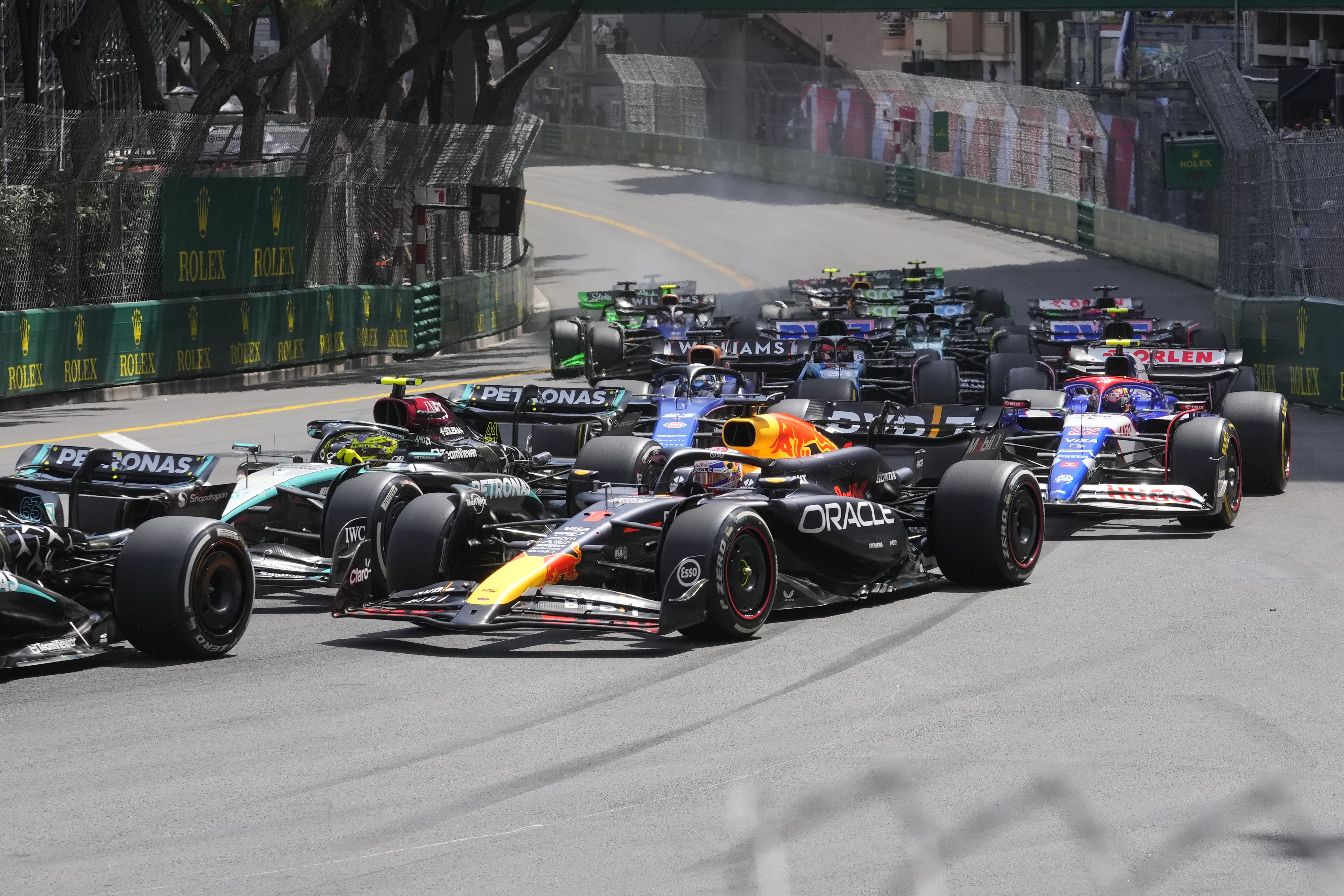 Red Bull driver Max Verstappen of the Netherlands, centre, steers his car during the Formula One Monaco Grand Prix race at the Monaco racetrack, in Monaco, Sunday, May 26, 2024. 