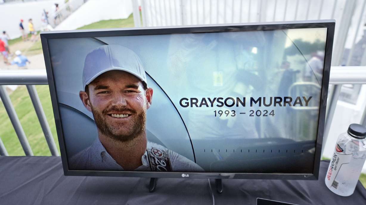 A golf television broadcast is played at the broadcast tent showing a photo of Grayson Murray during the third round of the Charles Schwab Challenge golf tournament at Colonial Country Club in Fort Worth, Texas, Saturday, May 25, 2024. Two-time PGA Tour winner Murray died Saturday morning at age 30, one day after he withdrew from the tournament.