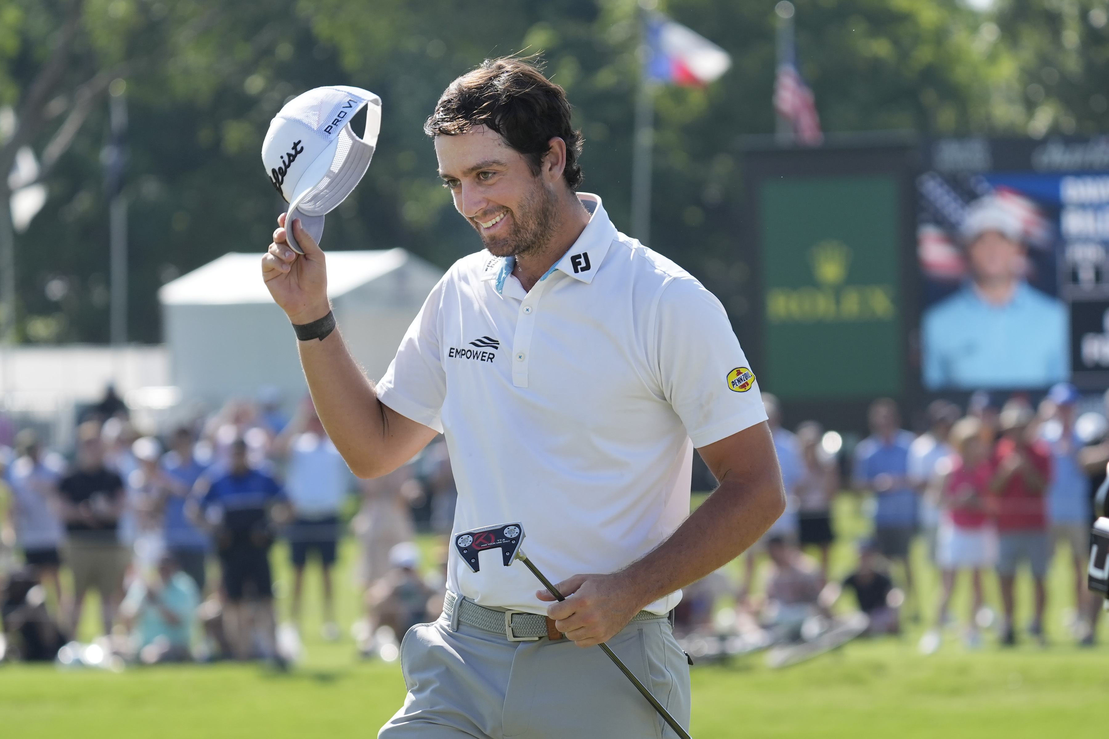 Davis Riley waves after winning the Charles Schwab Challenge golf tournament at Colonial Country Club in Fort Worth, Texas, Sunday, May 26, 2024. (AP Photo/LM Otero
