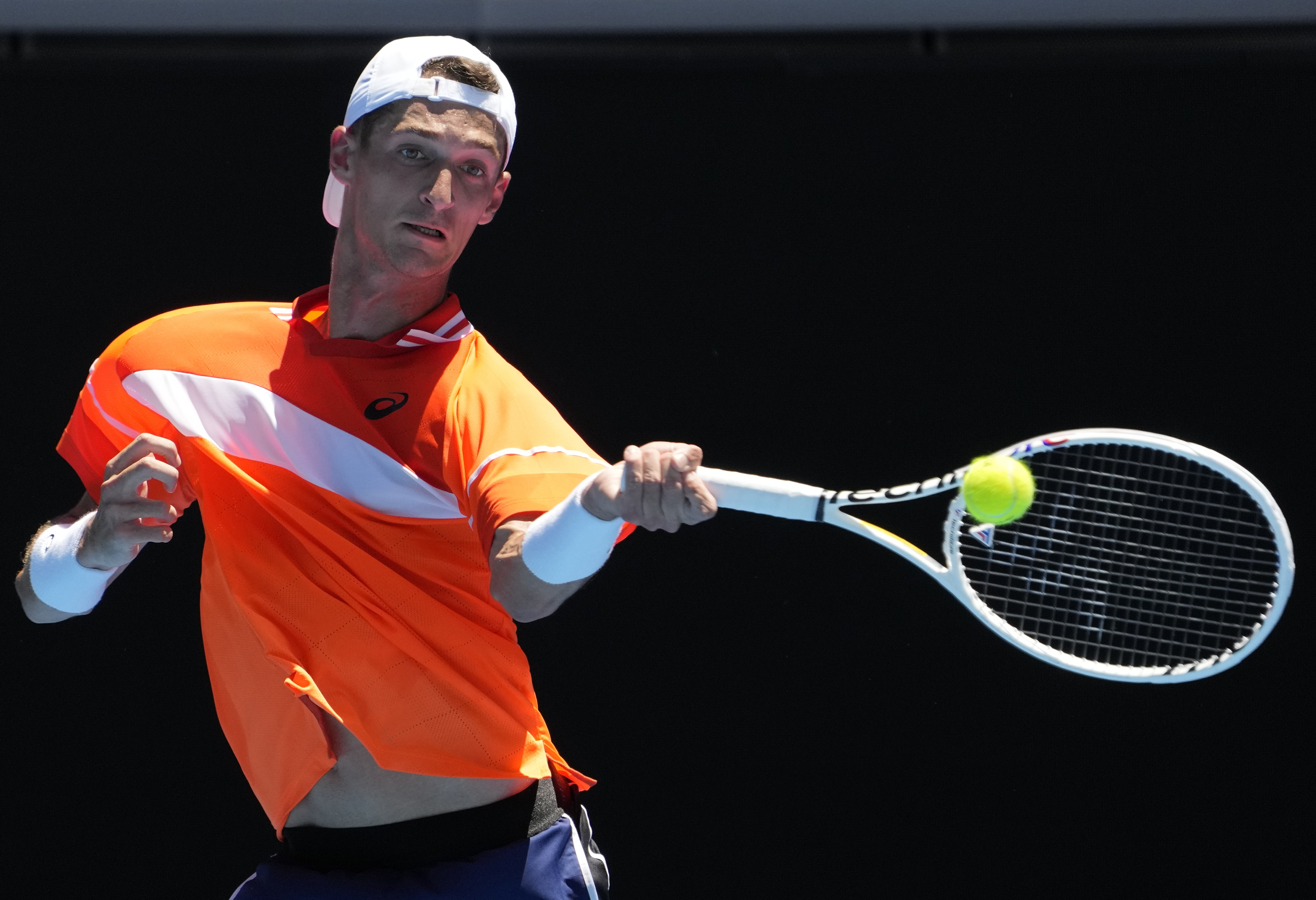 FILE - Terence Atmane, of France, plays a forehand return to Daniil Medvedev, of Russia, during a first-round match at the Australian Open tennis championships at Melbourne Park, Melbourne, Australia, Jan. 15, 2024. Atmane was allowed to continue his first-round match at the French Open, Sunday, May 26, 2024, without being penalized after hitting a ball angrily and accidentally striking a spectator in the stands at one of the event's smaller courts. His opponent, Sebastian Ofner, won the match in five sets. 
