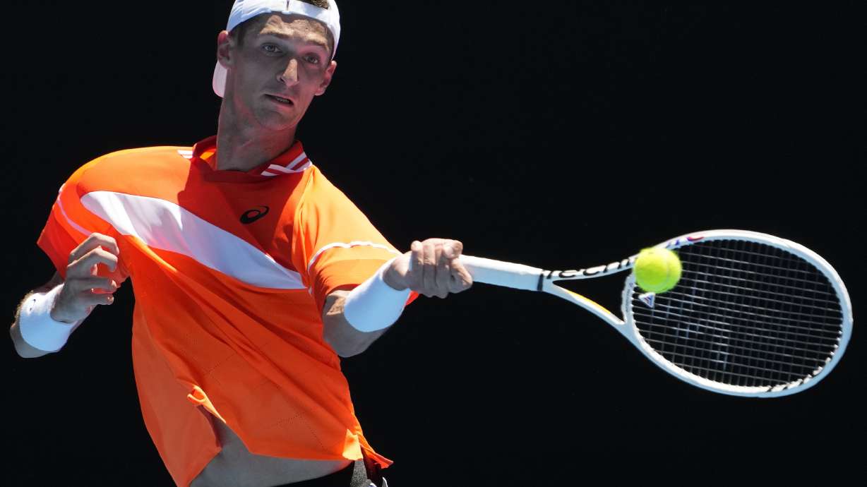 FILE - Terence Atmane, of France, plays a forehand return to Daniil Medvedev, of Russia, during a first-round match at the Australian Open tennis championships at Melbourne Park, Melbourne, Australia, Jan. 15, 2024. Atmane was allowed to continue his first-round match at the French Open, Sunday, May 26, 2024, without being penalized after hitting a ball angrily and accidentally striking a spectator in the stands at one of the event's smaller courts. His opponent, Sebastian Ofner, won the match in five sets.