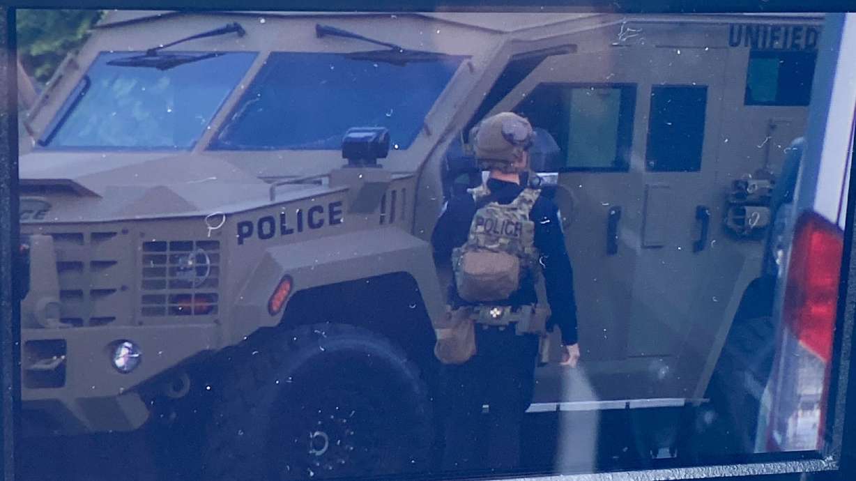 Police outside a South Salt Lake City home Monday morning. Authorities responded to a gathering of some sort where shots were fired in South Salt Lake early Monday, police said.