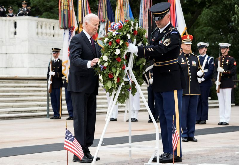 President Joe Biden participates in a wreath-laying ceremony at the Tomb of the Unknown Soldier during a National Memorial Day Wreath-Laying and Observance Ceremony at Arlington National Cemetery, in Washington Monday.
