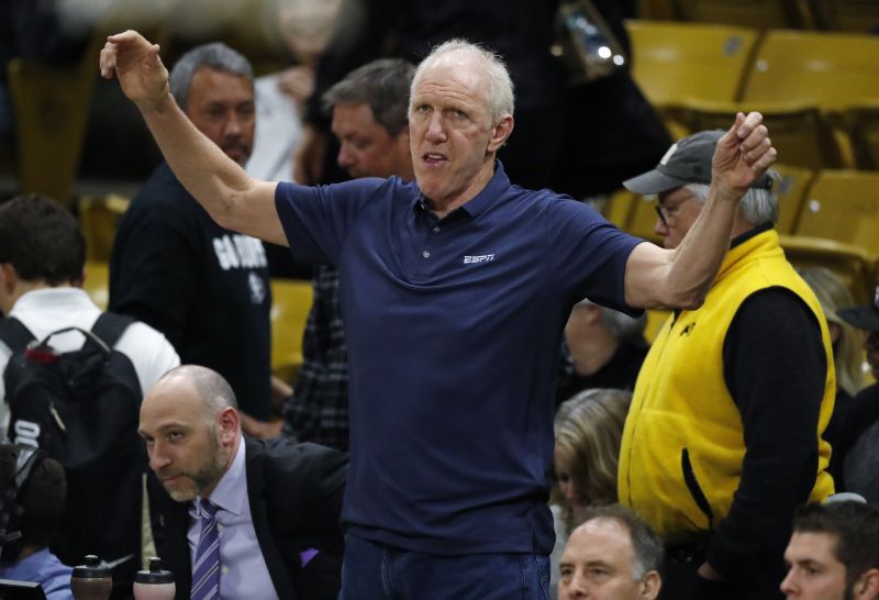 Television analyst Bill Walton stretches before the first half of an NCAA college basketball game between Oregon and Colorado, Jan. 2, 2020, in Boulder, Colo. Walton, died Monday. He was 71.