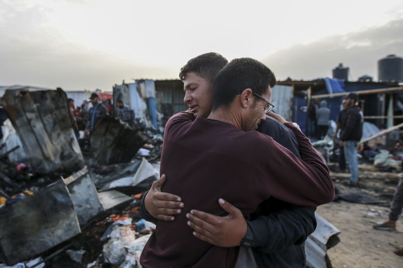 Palestinians react next to the destruction after an Israeli strike where displaced people were staying in Rafah, Gaza Strip, Monday.