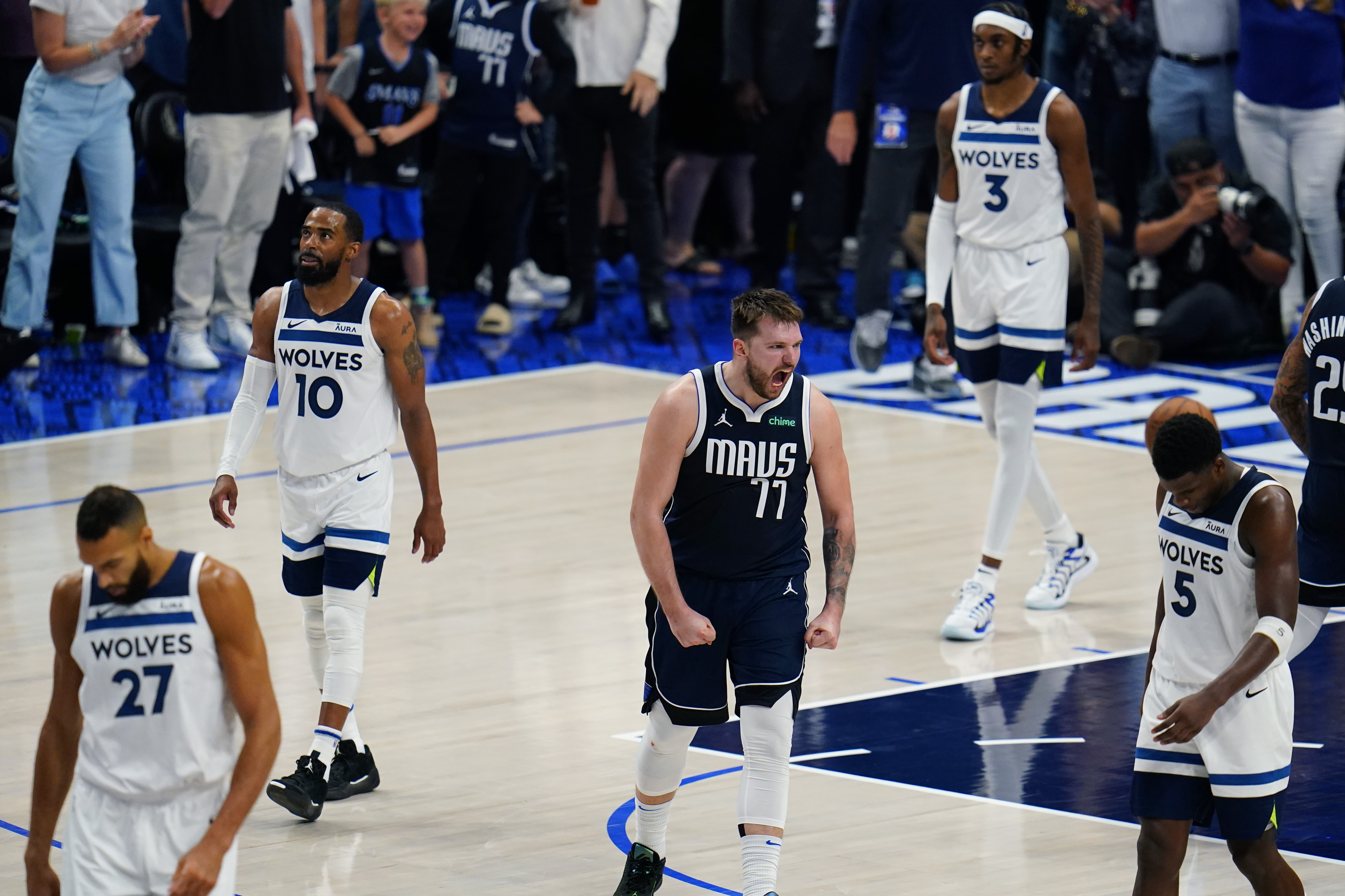 Dallas Mavericks guard Luka Doncic (77) celebrates a play against the Minnesota Timberwolves during the second half in Game 3 of the NBA basketball Western Conference finals, Sunday, May 26, 2024, in Dallas. 