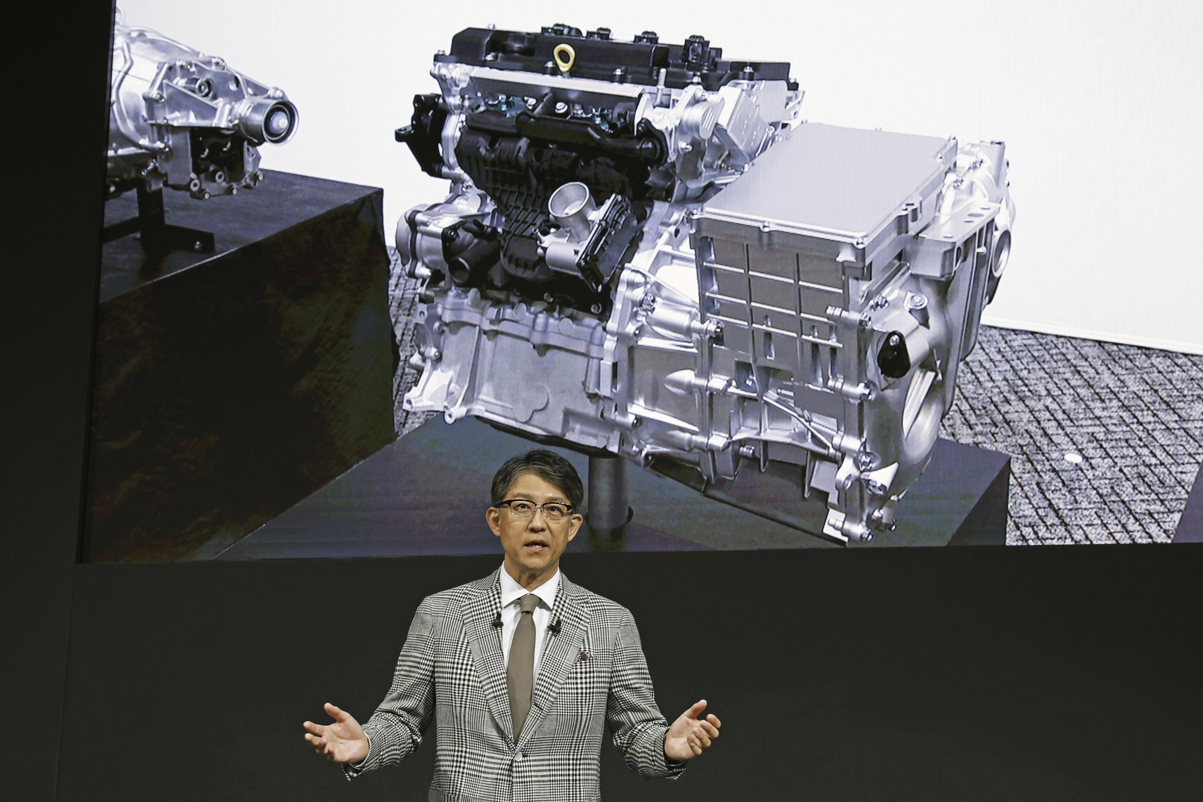 Koji Sato, chief executive of Toyota, speaks in Tokyo, Tuesday. Toyota introduced plans for a new lean compact motor that will cast a futuristic spin on the traditional internal combustion engine. 