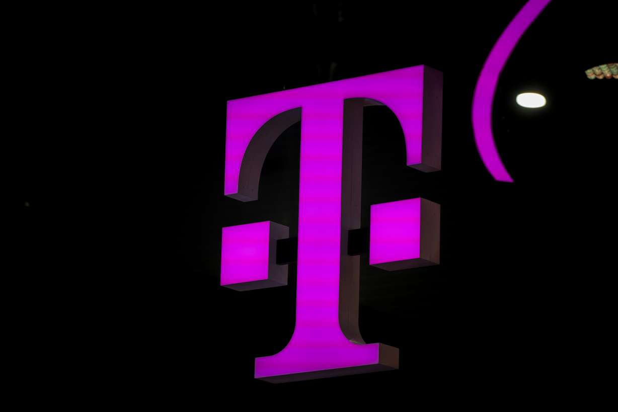 The T-Mobile logo in the Mobile World Congress in Barcelona, Spain on March 2, 2023. National security and tech experts say groups linked to China have burrowed deep into telecommunication networks.