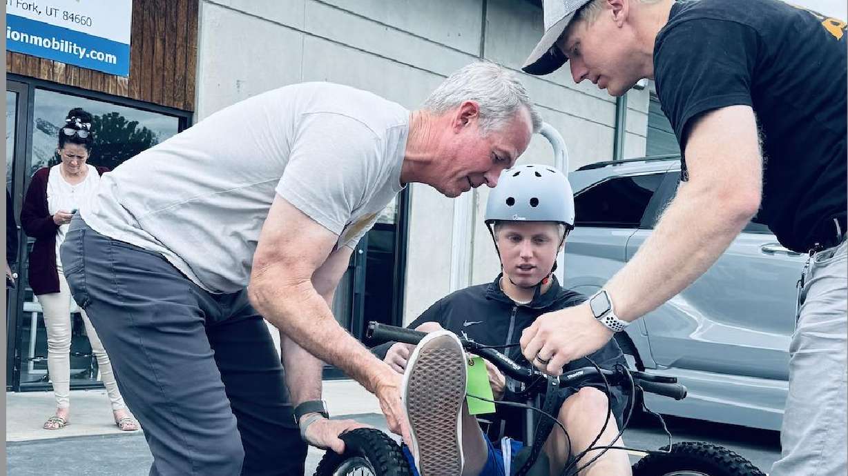 Calvin Smith, 17, tries an adaptive bike after learning he has an inoperable brain tumor. His community is hosting a fundraiser Wednesday to cover the cost for the family.