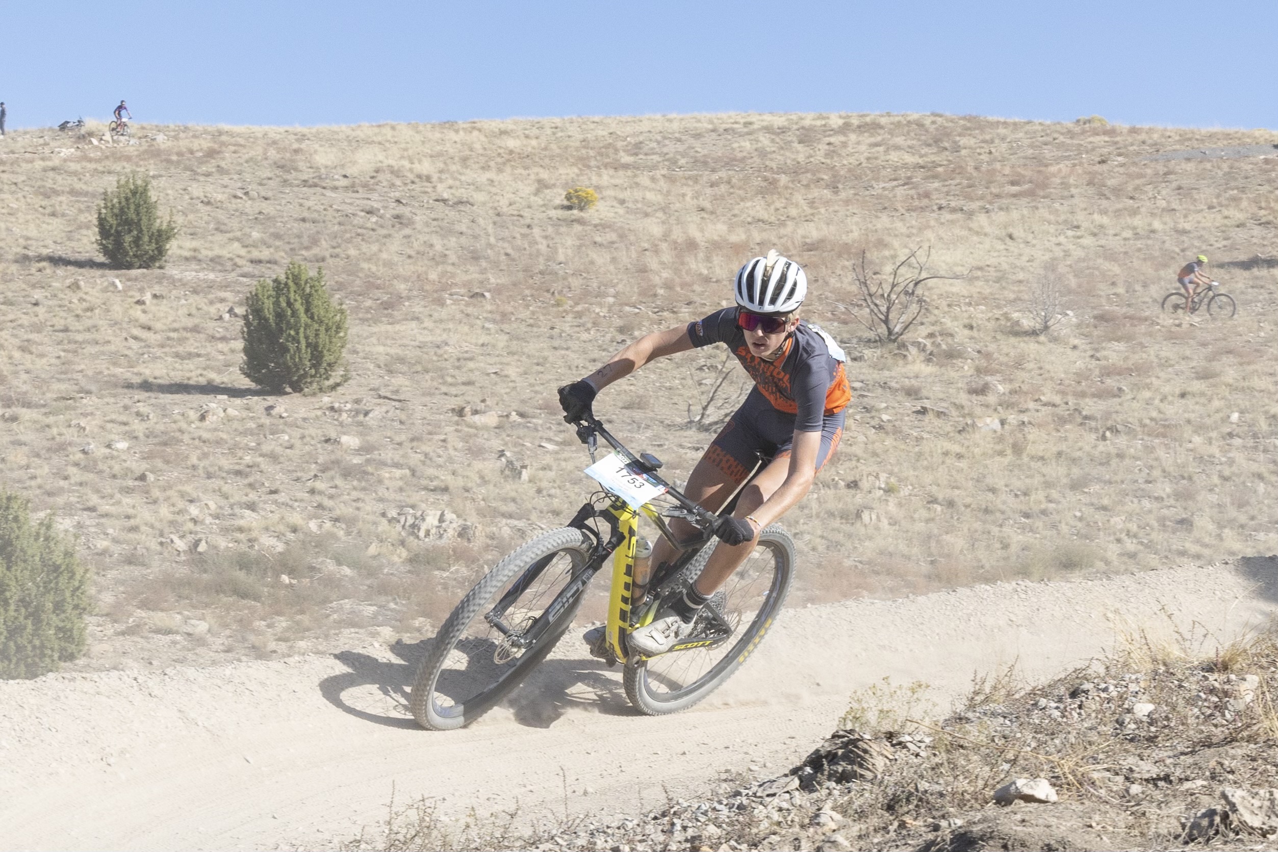 Calvin Smith races a mountain bike for Skyline High School. The 17-year-old was diagnosed with brain cancer at age 9, and an inoperable tumor has now paralyzed his right side.