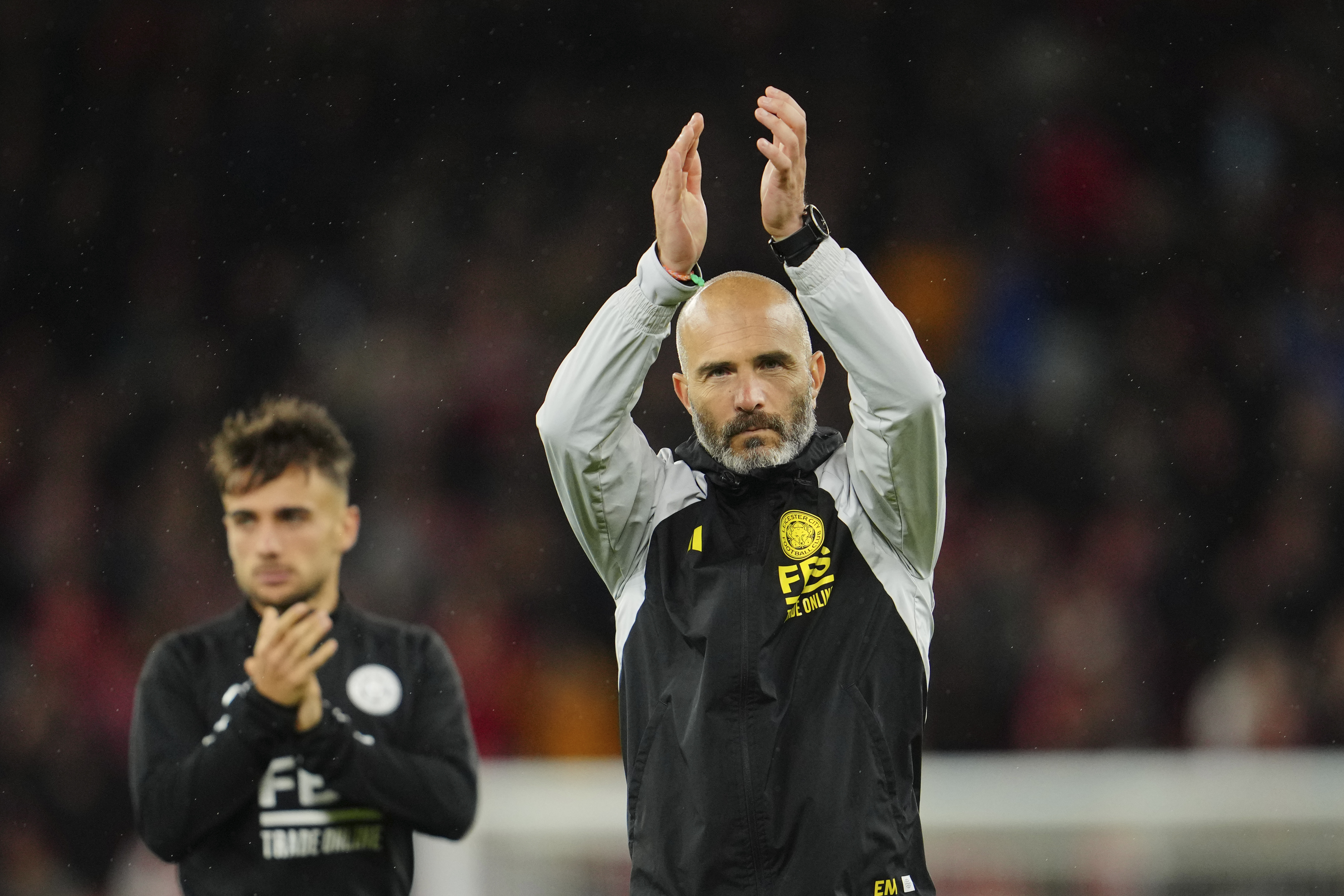 FILE - Leicester's head coach Enzo Maresca applauds fans at the end of the English League Cup third round soccer match between Liverpool and Leicester City at the Anfield stadium in Liverpool, England, Wednesday, Sept. 27, 2023. There is unprecedented managerial upheaval in the English Premier League. Five of the top 11 teams potentially will have new coaches at the start of next season and another of them changed managers just three months ago.