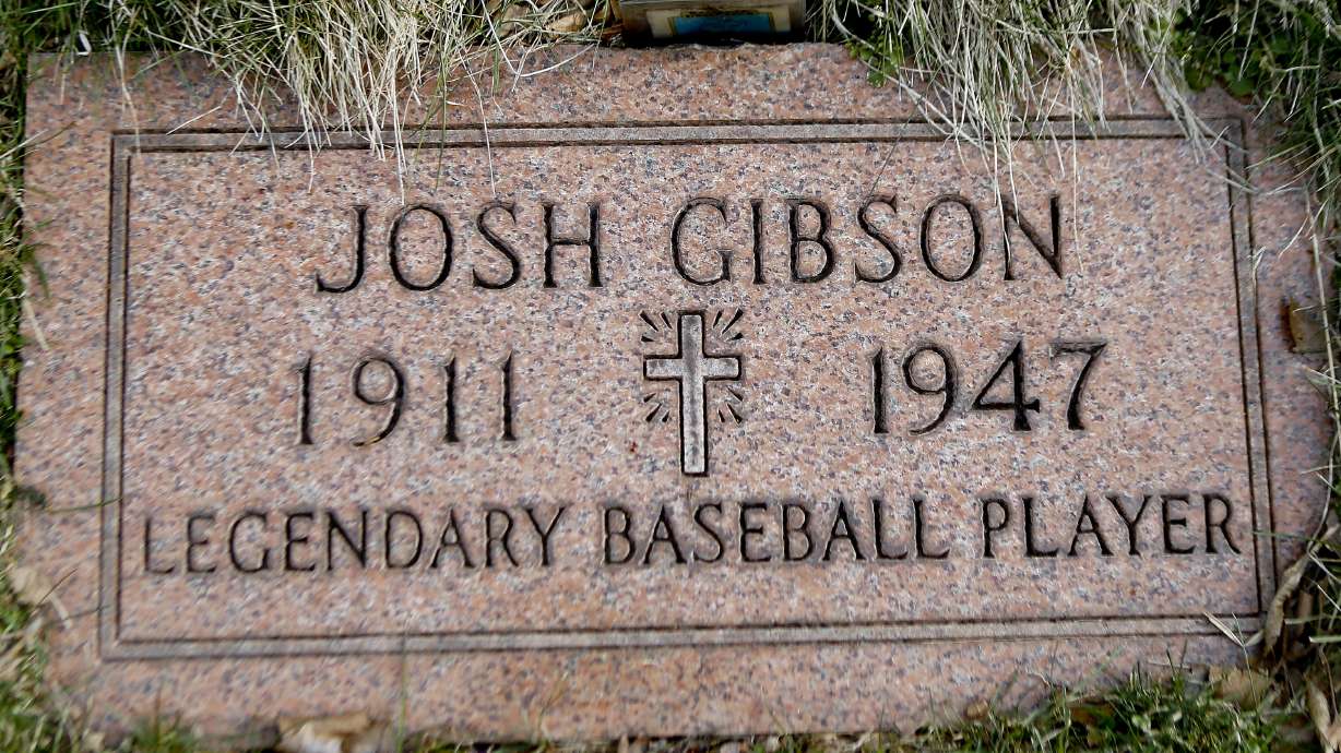 The grave stone for baseball player Josh Gibson is shown at Allegheny Cemetery in Pittsburgh on March 17, 2017. Gibson became Major League Baseball’s career batting leader with a .372 average, surpassing Ty Cobb’s .367 when records of the Negro Leagues for more than 2,300 players were incorporated Tuesday, May 28, 2024, after a three-year research project.