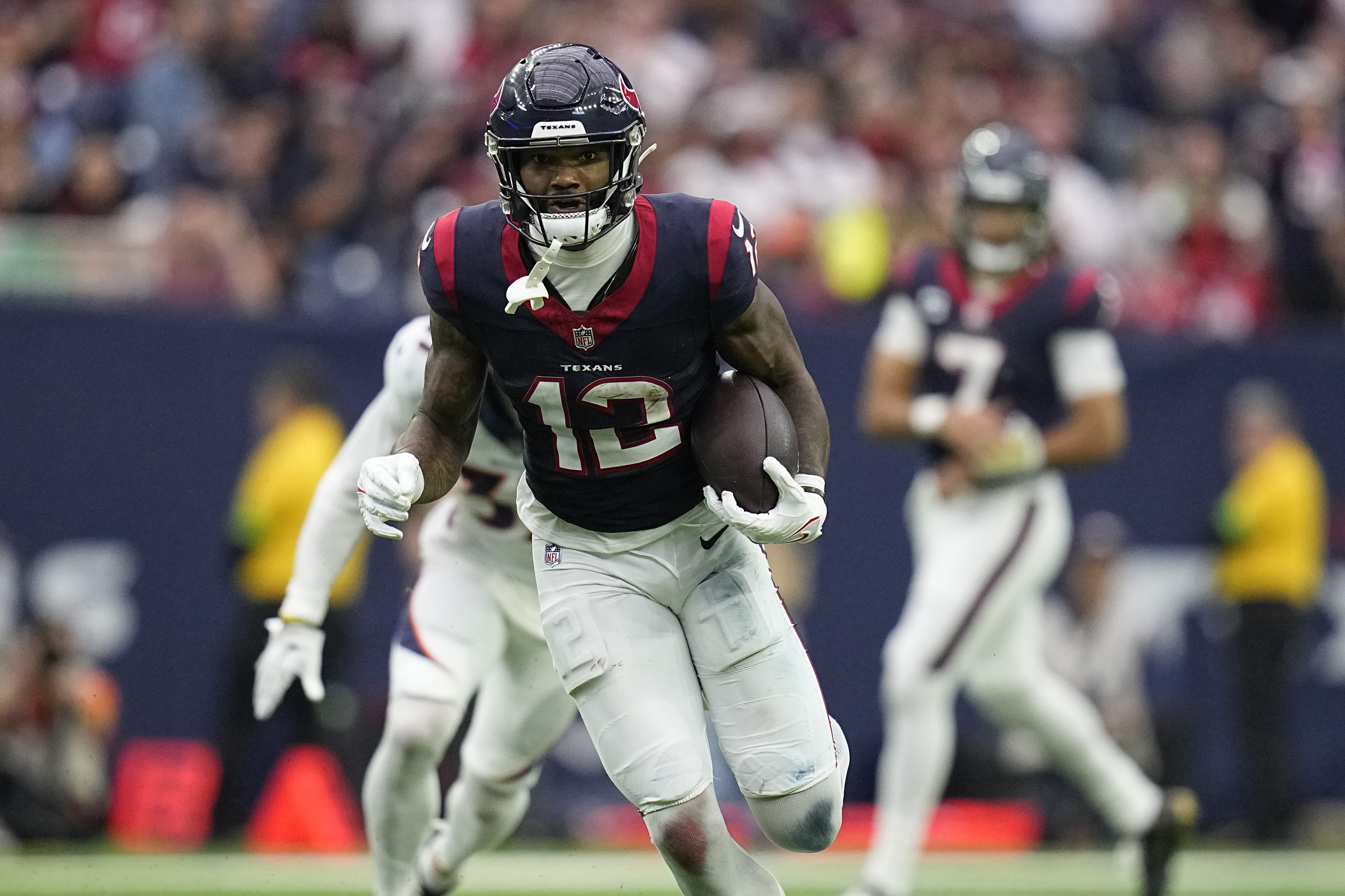 FILE -Houston Texans wide receiver Nico Collins (12) during an NFL football game against the Denver Broncos Sunday, Dec. 3, 2023, in Houston. The Houston Texans agreed with wide receiver Nico Collins to a three-year extension worth up to $75 million with $52 million guaranteed on Tuesday, May 28, 2024. 