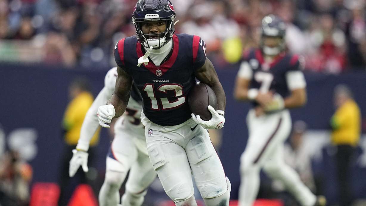 FILE -Houston Texans wide receiver Nico Collins (12) during an NFL football game against the Denver Broncos Sunday, Dec. 3, 2023, in Houston. The Houston Texans agreed with wide receiver Nico Collins to a three-year extension worth up to $75 million with $52 million guaranteed on Tuesday, May 28, 2024.