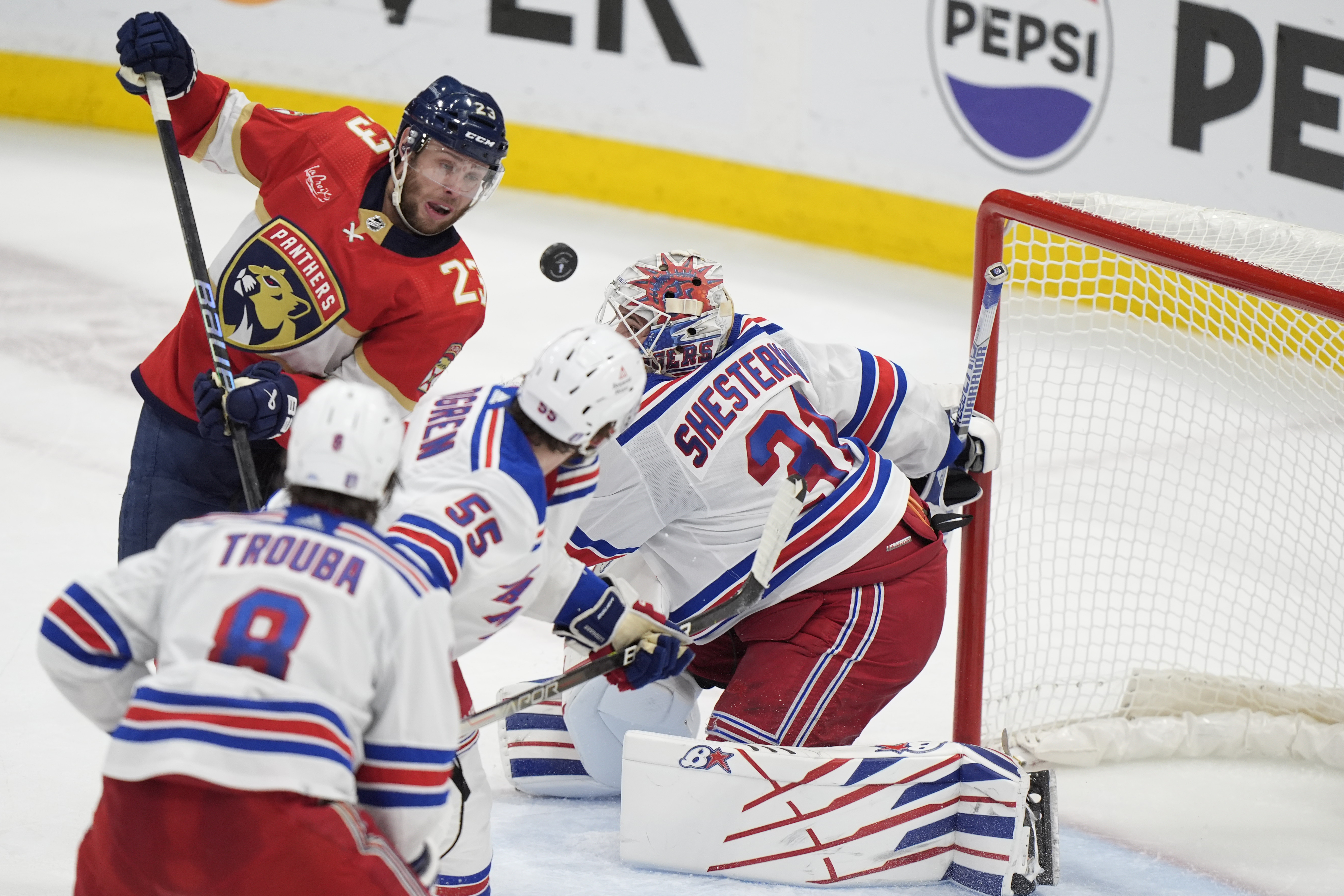 Florida Panthers center Carter Verhaeghe (23) scores against New York Rangers goaltender Igor Shesterkin (31) during the second period of Game 4 during the Eastern Conference finals of the NHL hockey Stanley Cup playoffs, Tuesday, May 28, 2024, in Sunrise, Fla.