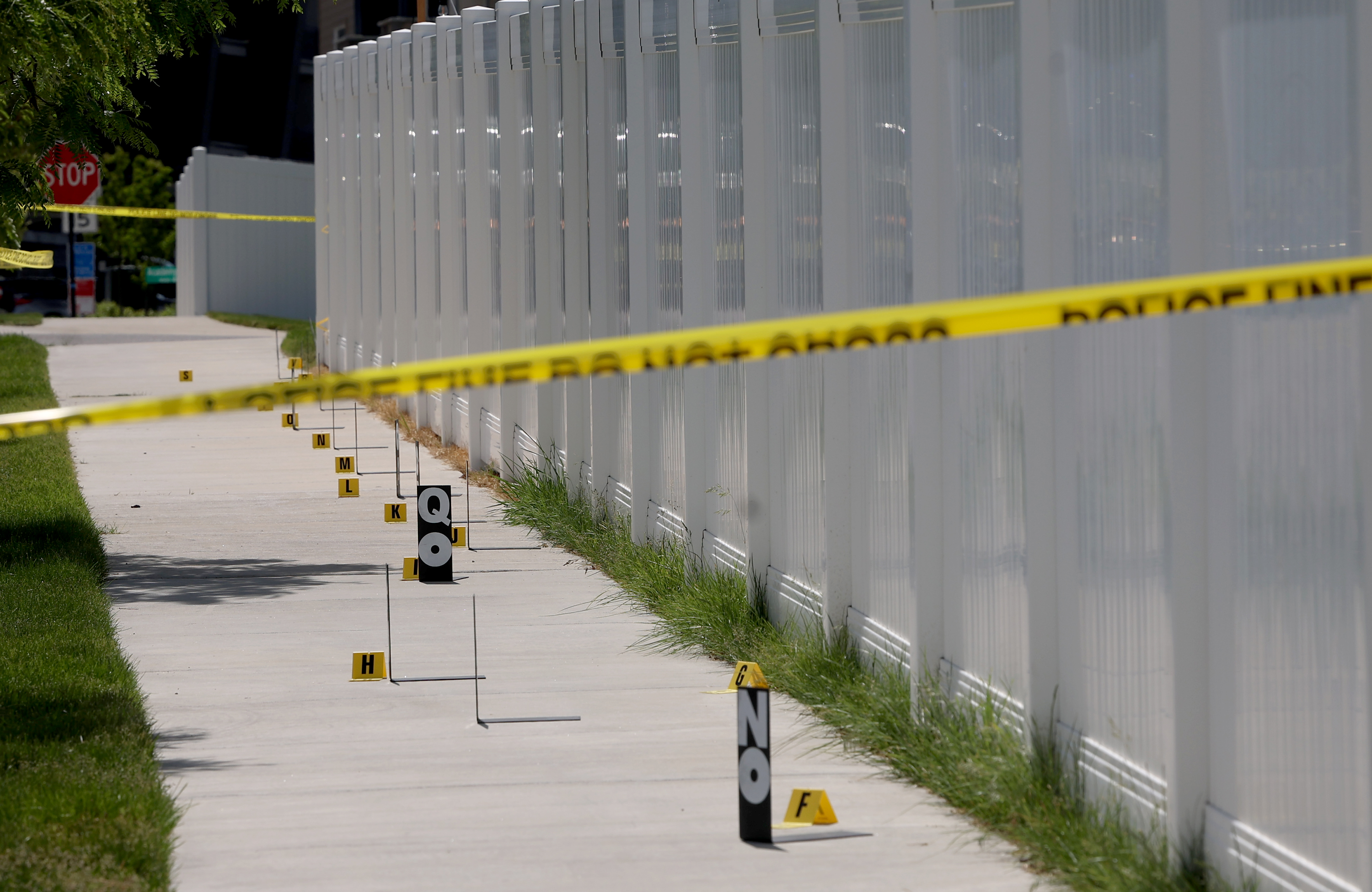 Police investigate the scene where a 16-year-old was stabbed to death inside a car in Herriman Wednesday.