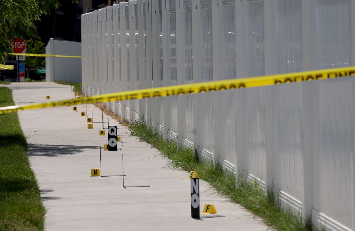 Police investigate the scene where a 16-year-old was stabbed to death inside a car in Herriman Wednesday.