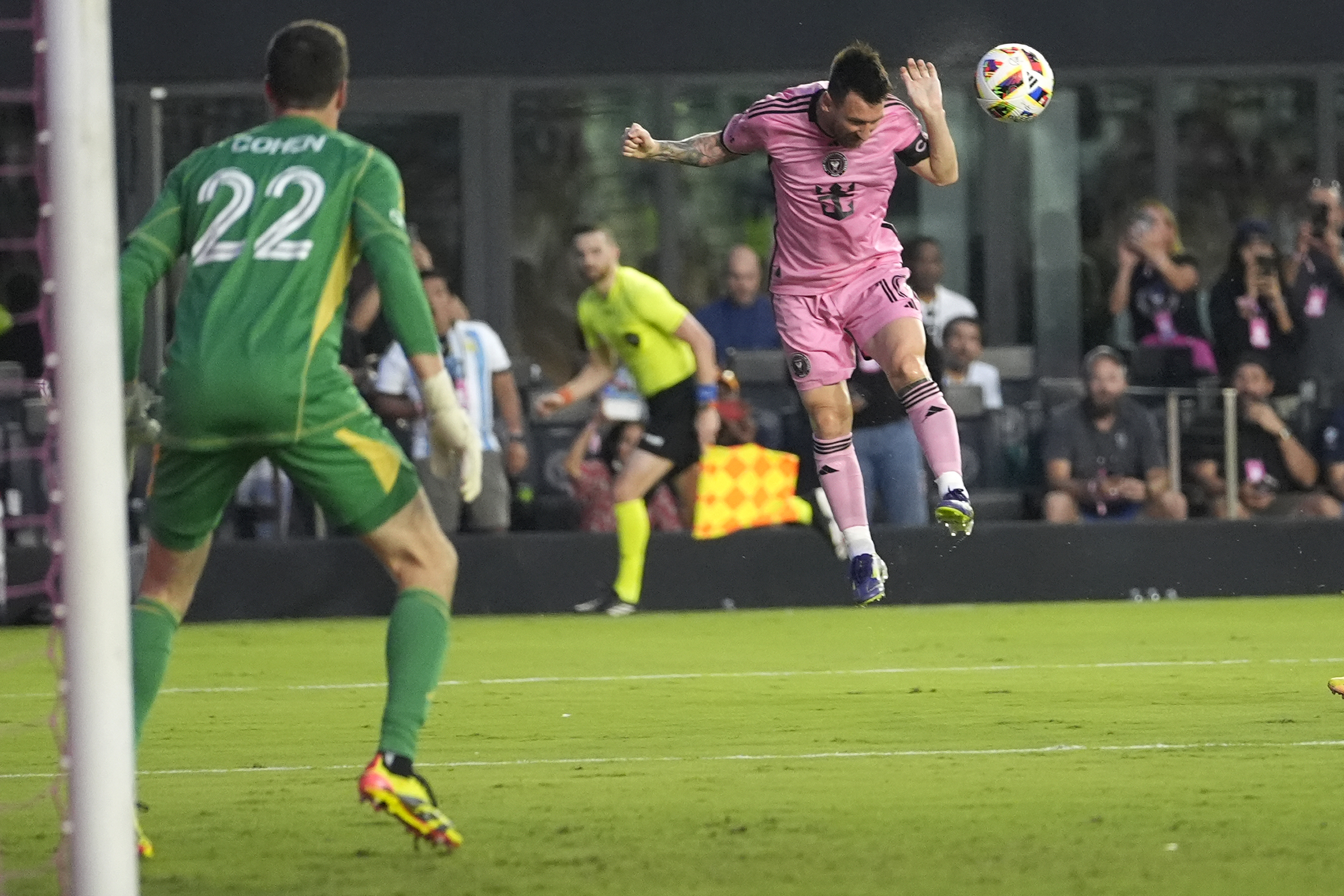Inter Miami forward Lionel Messi, right, heads the ball as Atlanta United goalkeeper Josh Cohen (22) watches during the first half of an MLS soccer match Wednesday, May 29, 2024, in Fort Lauderdale, Fla. 