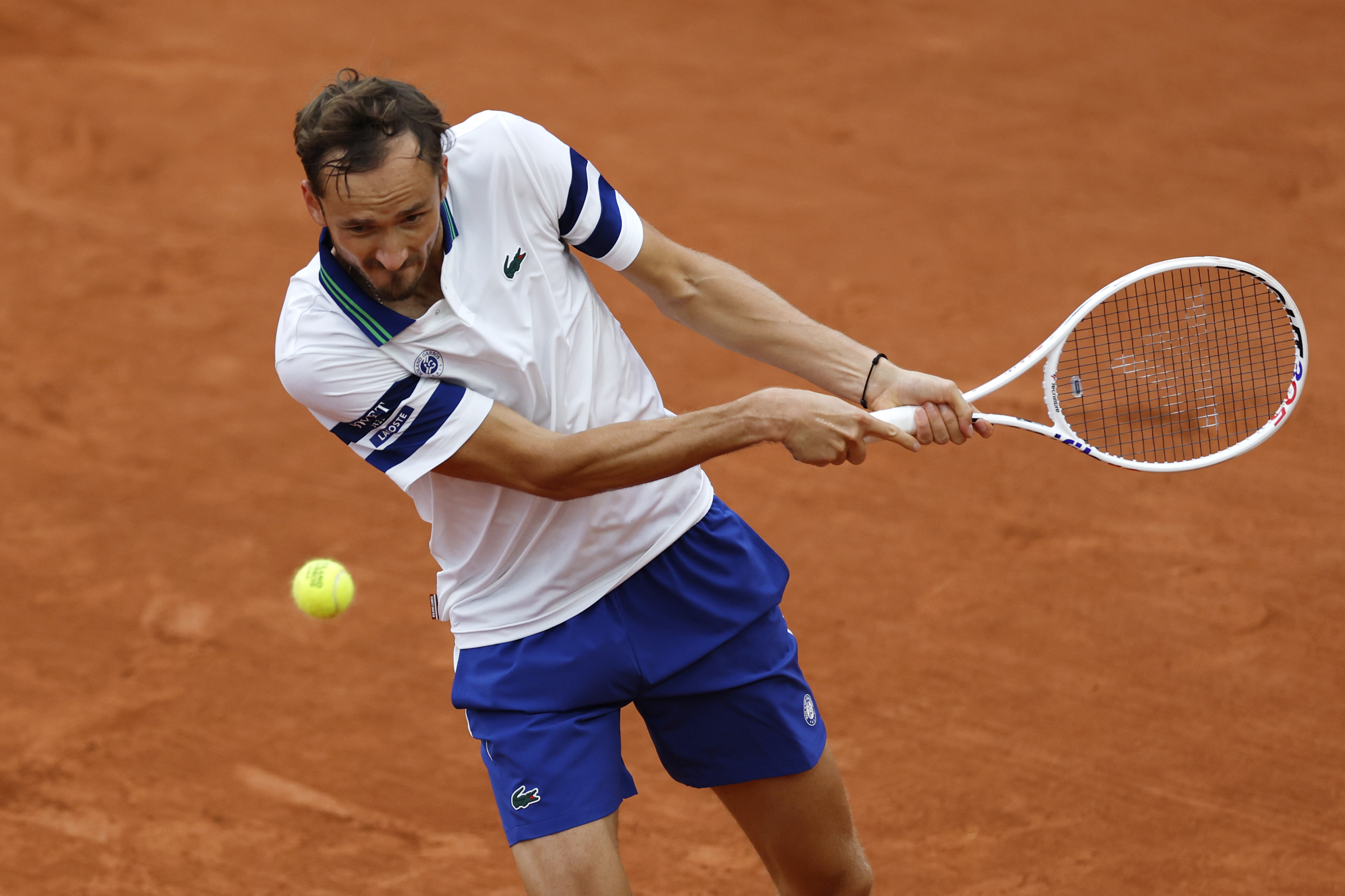 Russia's Daniil Medvedev plays a shot against Serbia's Miomir Kecmanovic during their second round match of the French Open tennis tournament at the Roland Garros stadium in Paris, Thursday, May 30, 2024.